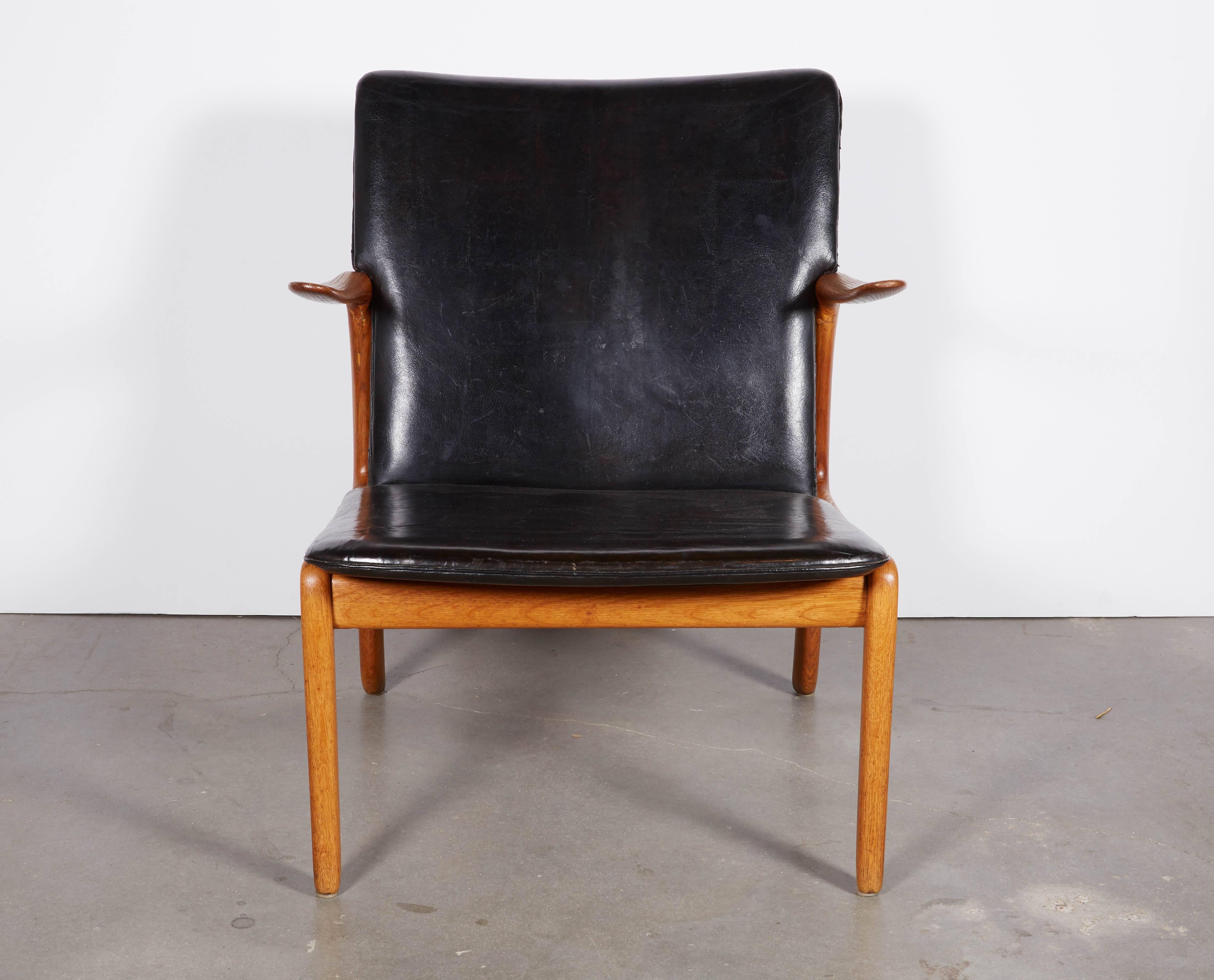 Vintage 1950s Danish Armchair by Ole Wanscher

This mid century lounge chair is in excellent condition. The oak structure is well kept and has a lovely aged look. The leather is original. Ready for pick up, delivery, or shipping anywhere in the