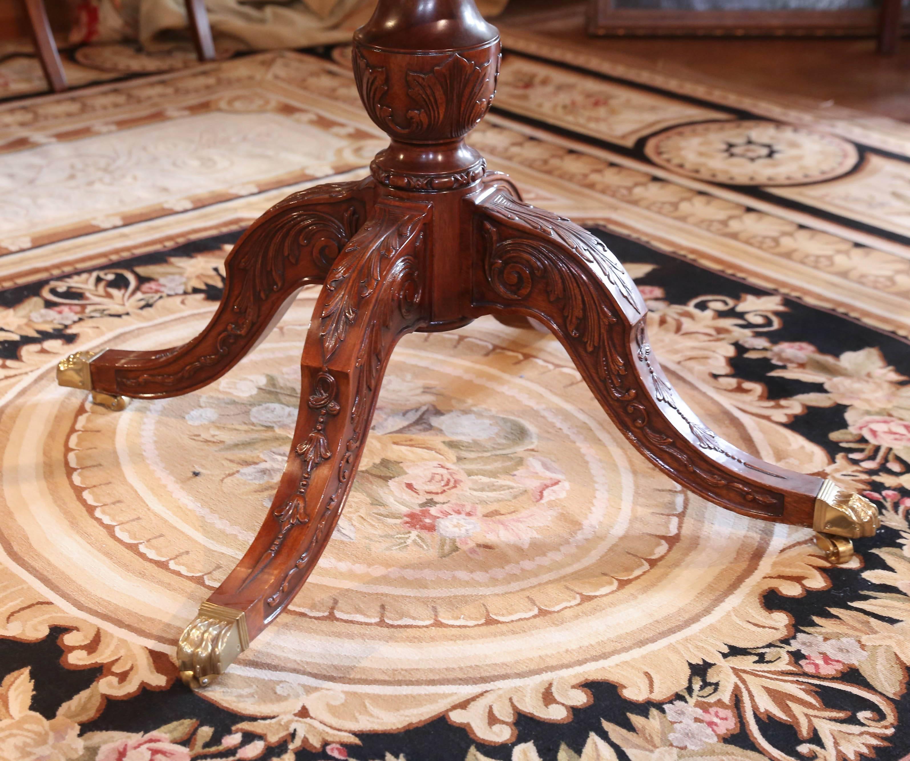 Mahogany carved pedestal base with elegant centre carving
Inside an octagonal shaped top. The glass is new and has
a bevel that is one inch wide.