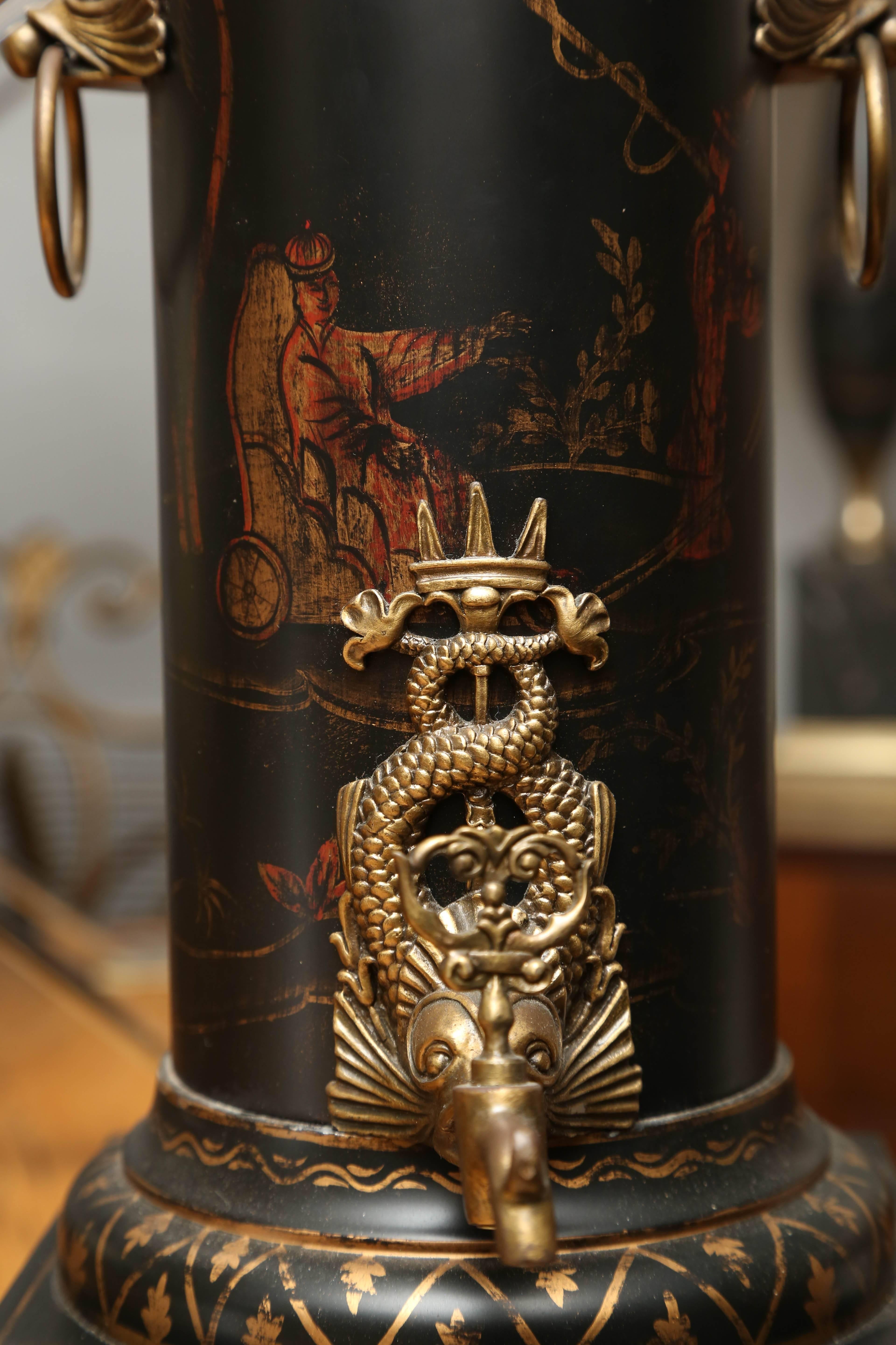 A superb example decorated with splendid handles, lion paw feet and dolphin motif spout.
[Measurement is to socket].