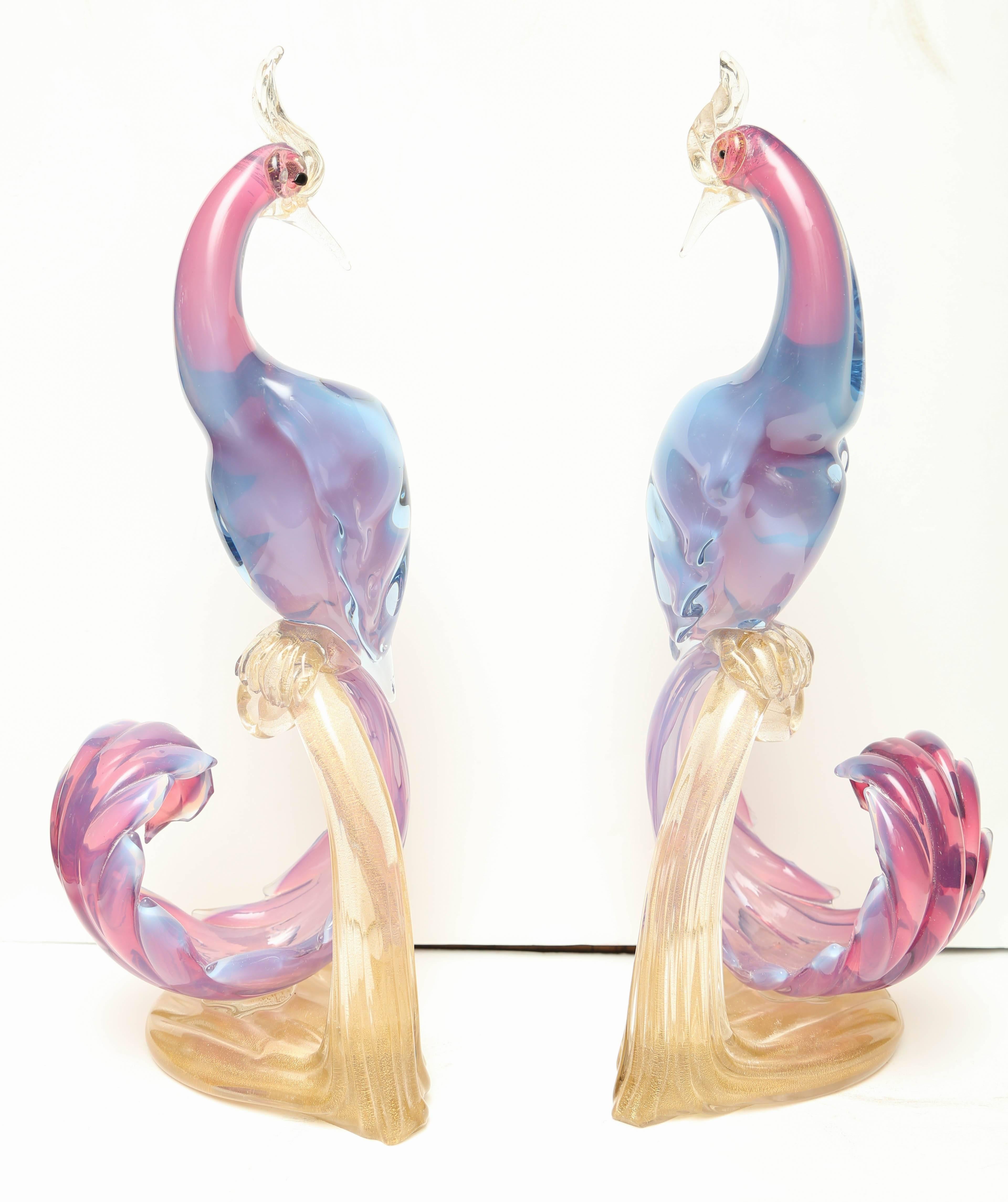 An exquisite and fanciful pair with shades of lavender, blue, and gold.
Significant size.