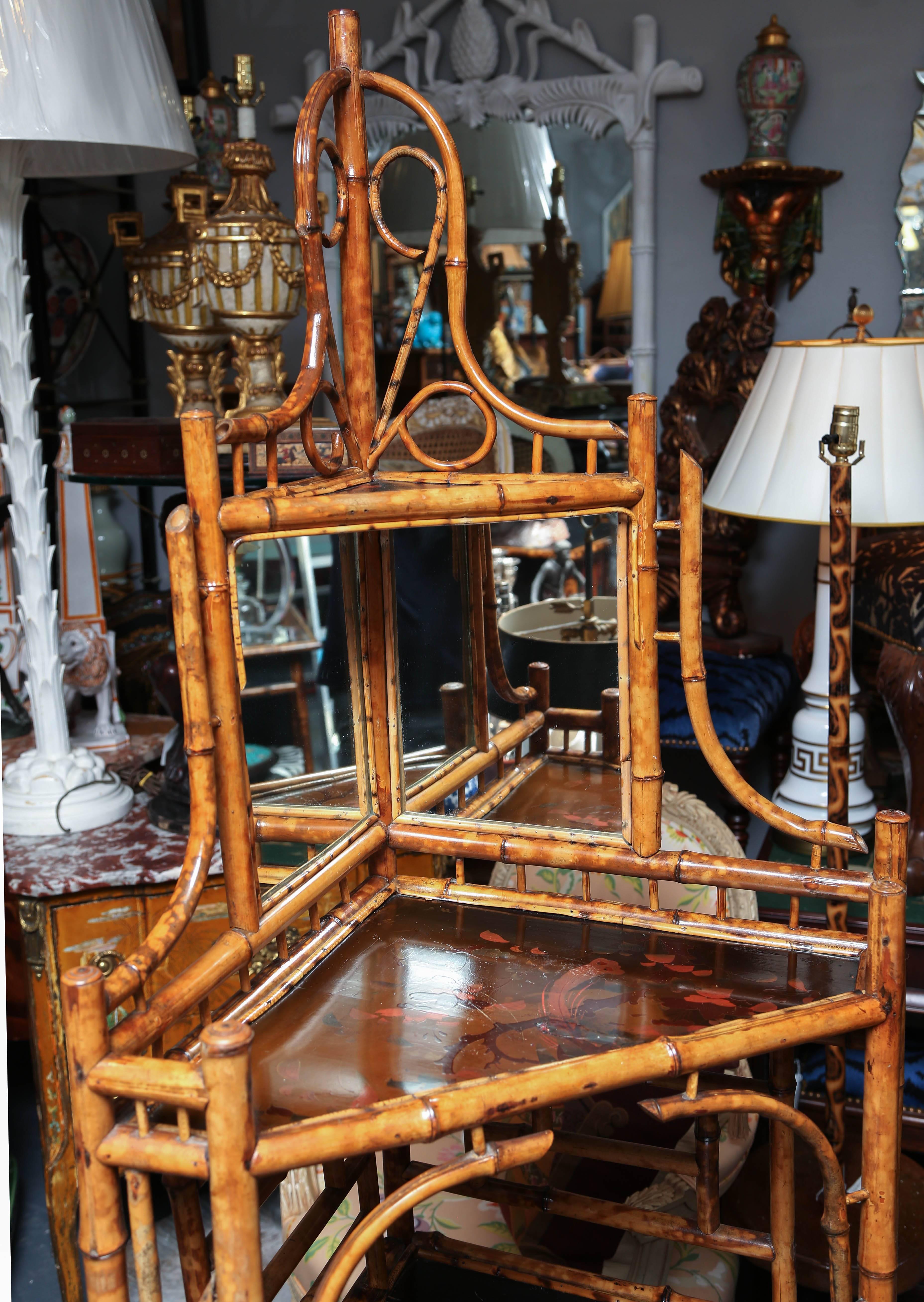 Generously scaled and nicely appointed with floral decorated lacquered panels and glass doors.
Elegantly stylized for any collection.