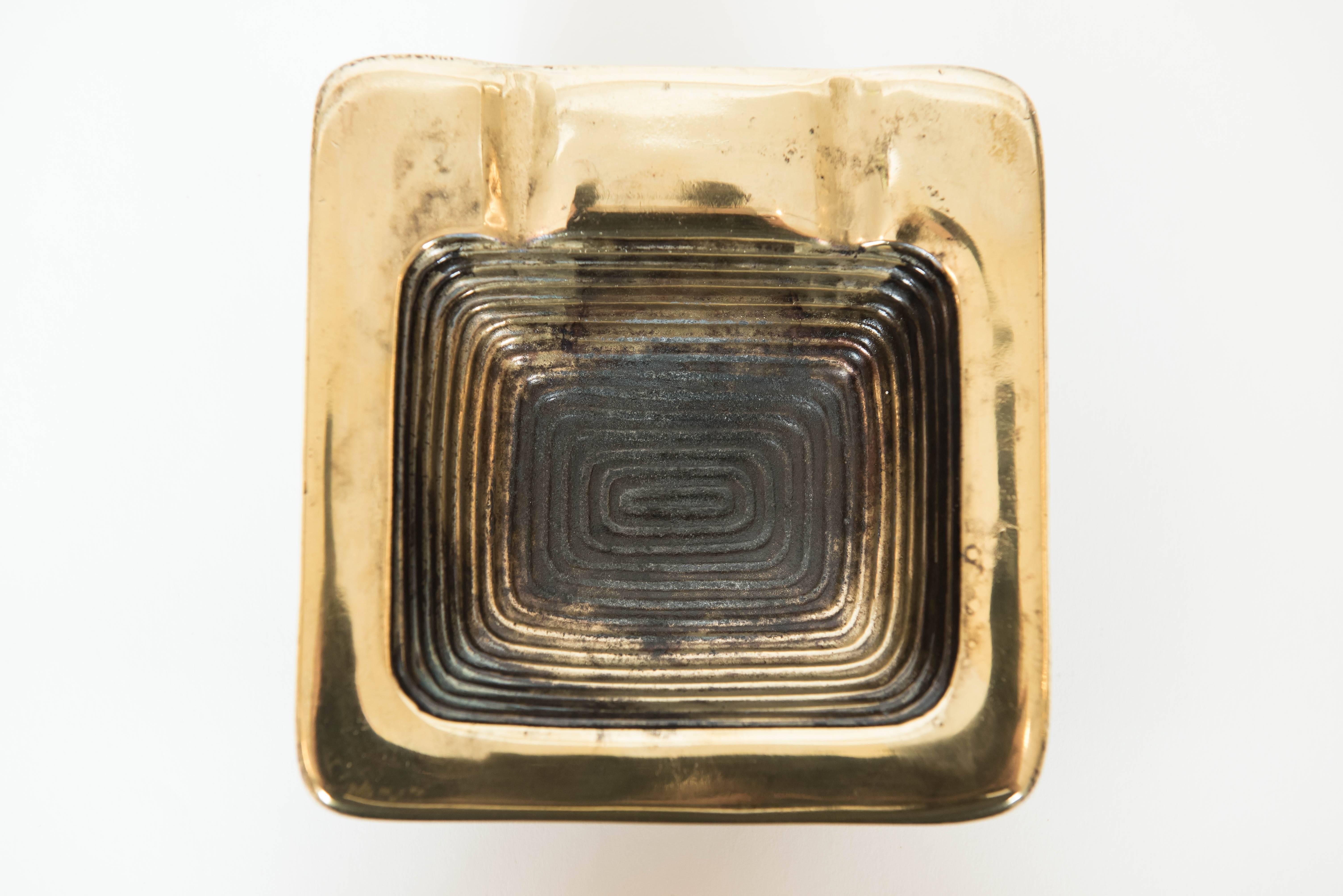 This ribbed Ben Seibel sculptural ashtray in antique brass finish adds panache to many a room!