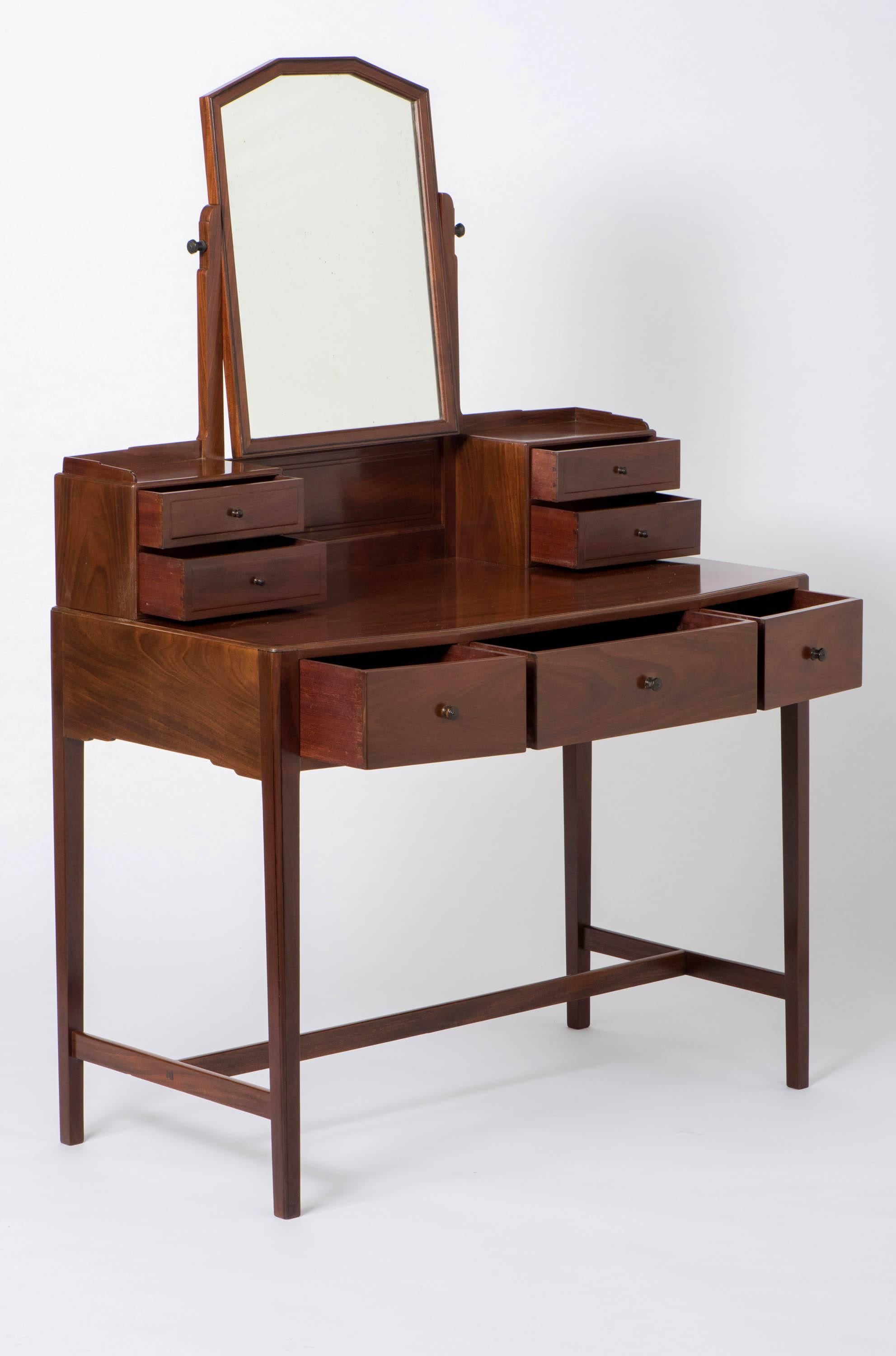 Edward Barnsley mahogany dressing table with ebonized handles England, circa 1930
Measure: 99 cm wide x 150 cm high x 50 cm deep
Prov; Private collection of Edward Barnsley Furniture.
 