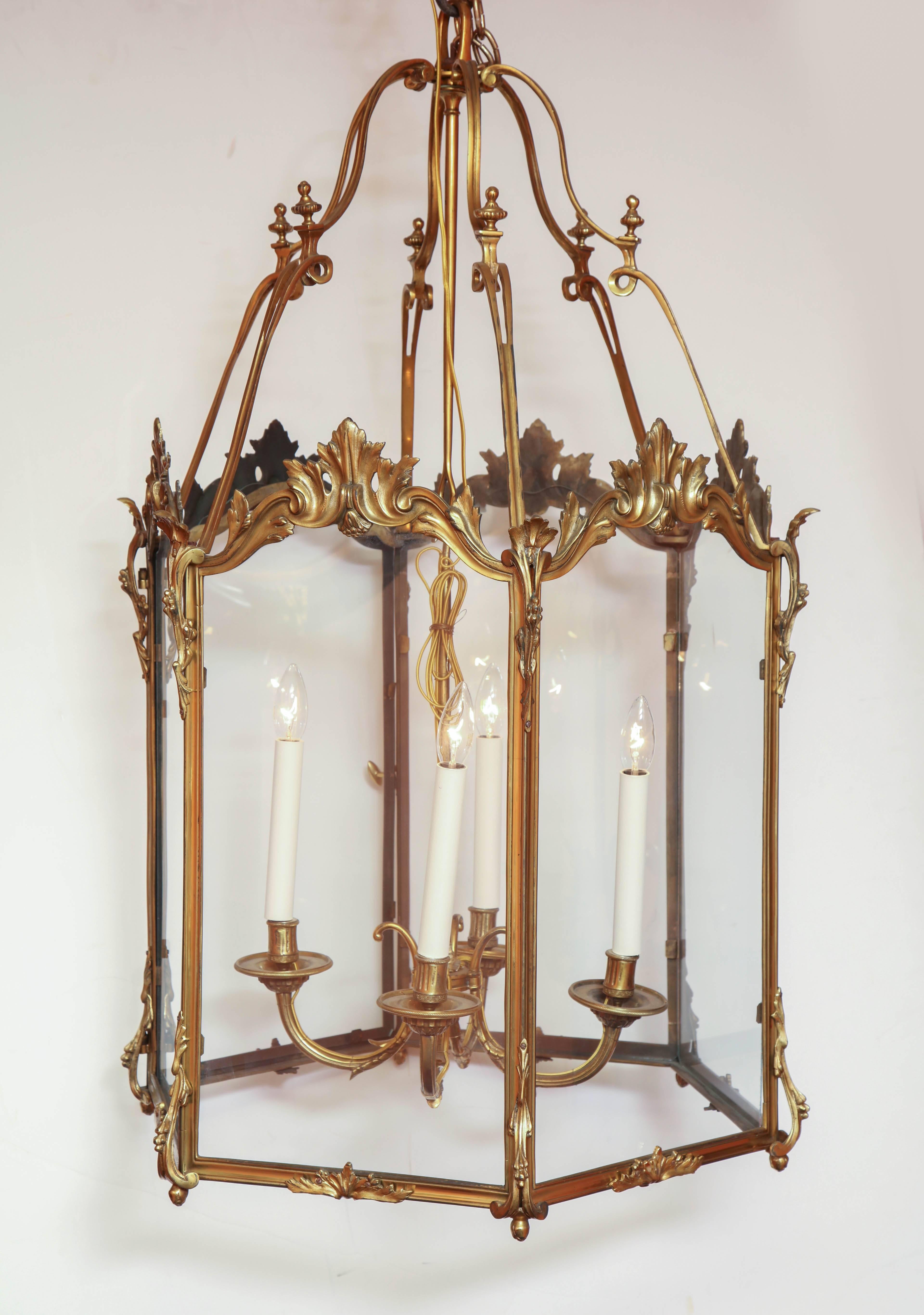 A very fine pair of large gilt bronze four light 'Chateau' lanterns. 
