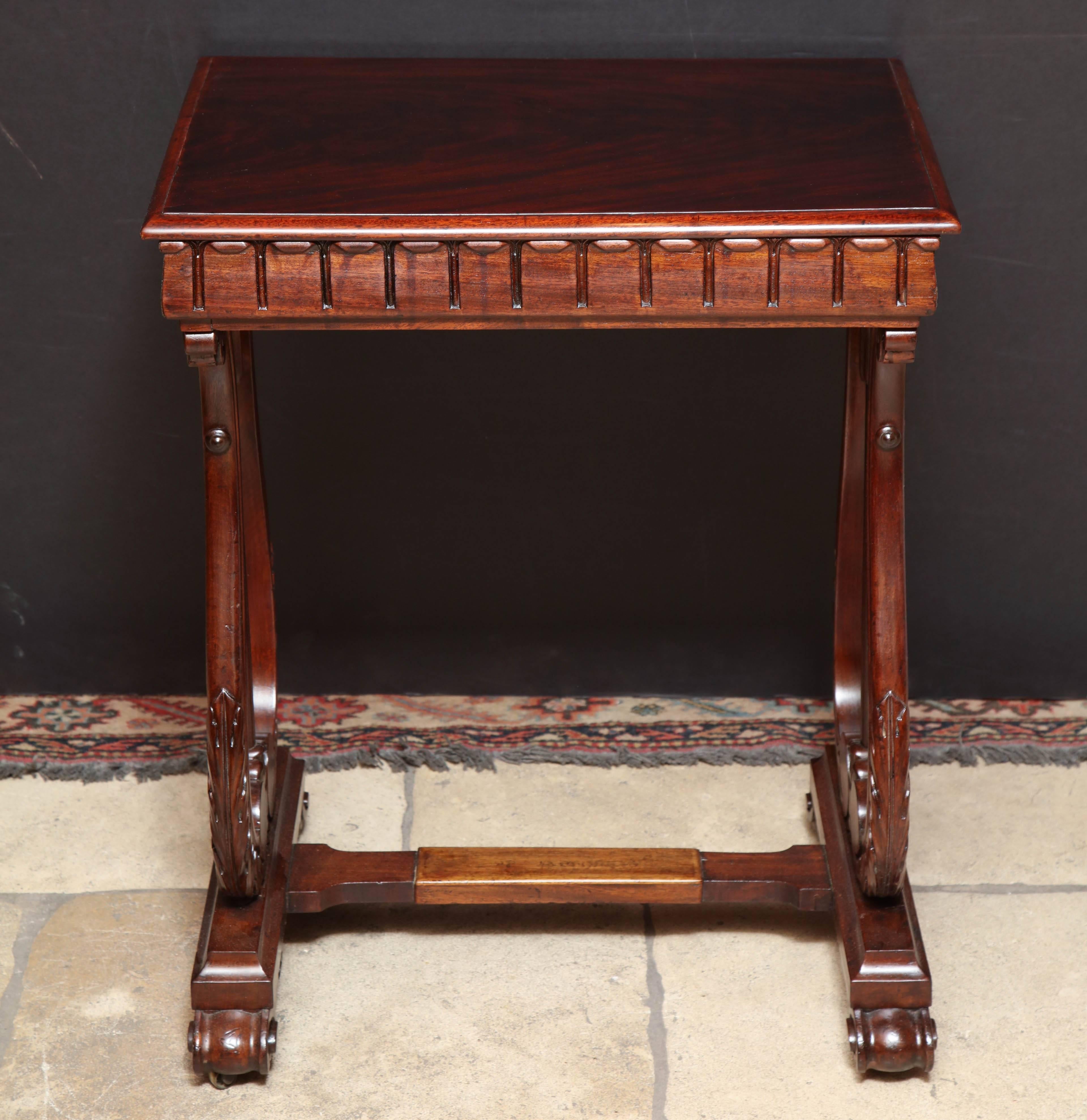 Regency rosewood one drawer side table with lyre form trestle end, lotus leaf motif sides and stretcher base. 