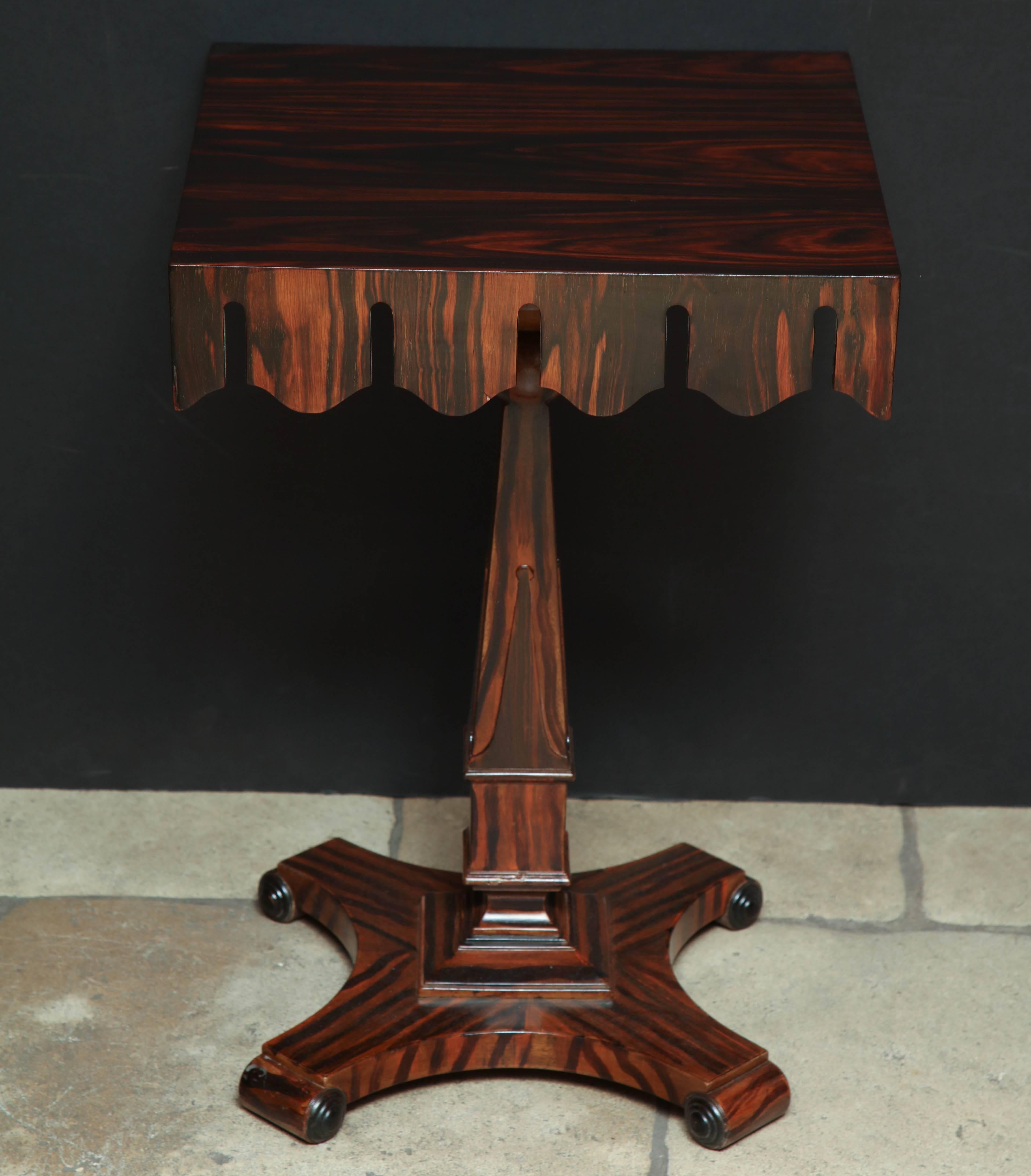 French Art Deco rosewood side table with scalloped rails and pedestal base.