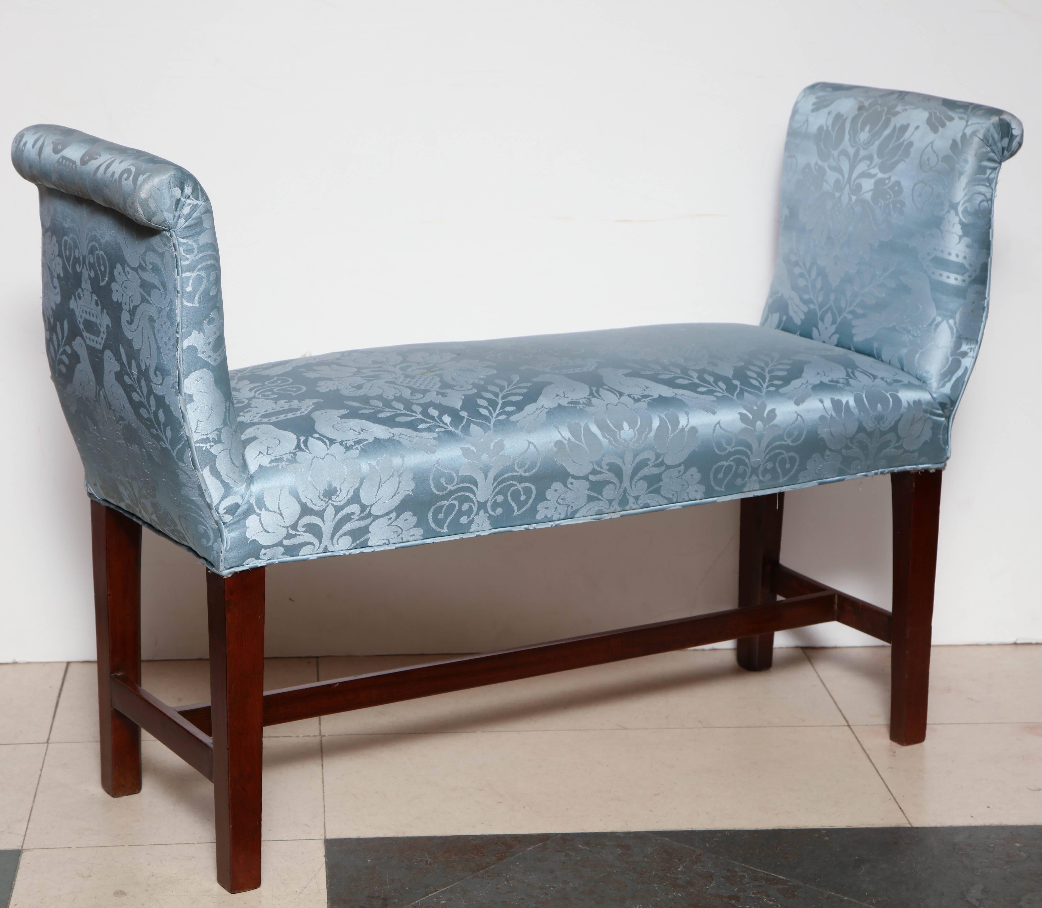 Pair of George III mahogany scroll arm window benches with square tapered legs and H stretcher.