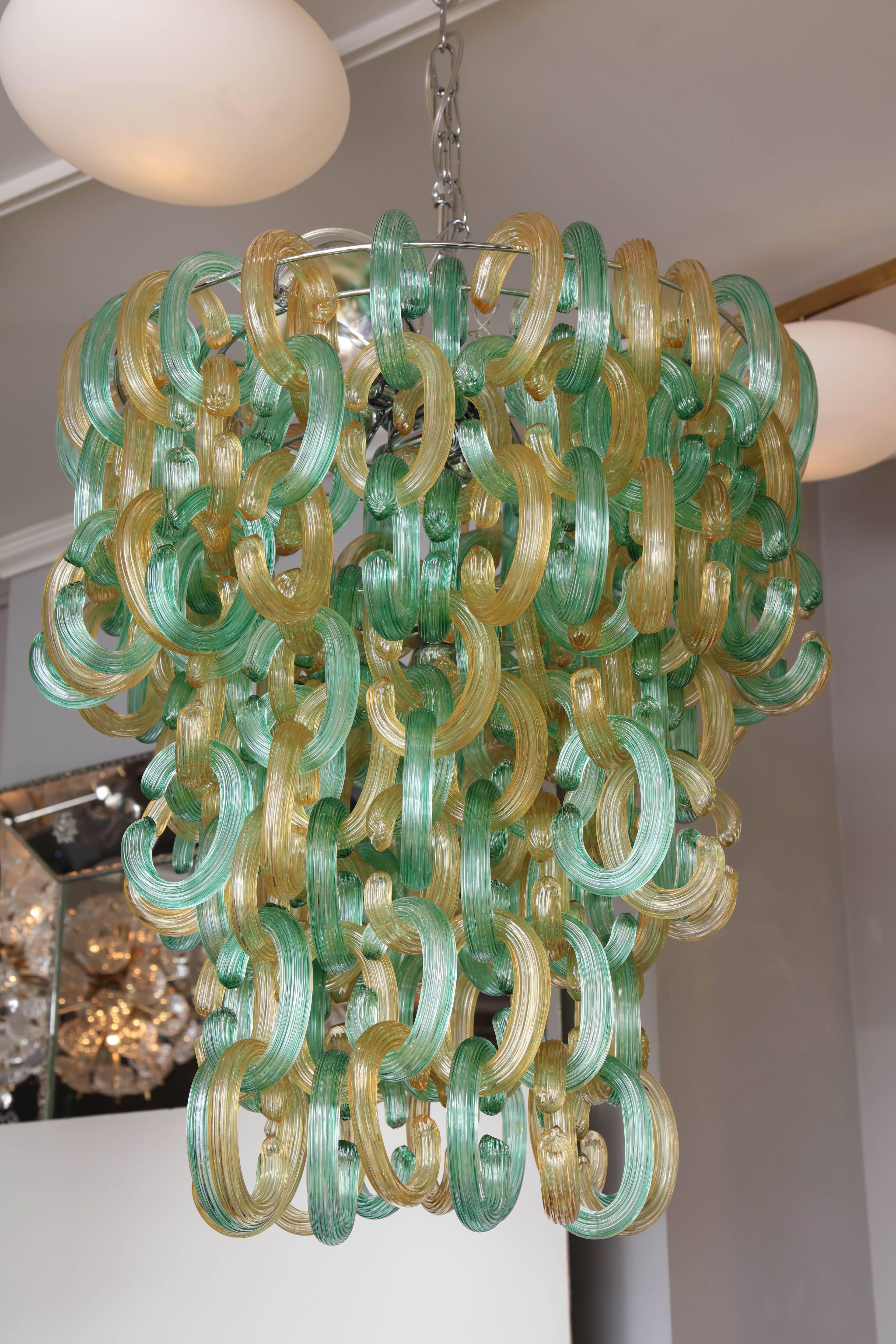 Green and gold Murano C-link glass chandelier. This is a floor model chandelier on sale.