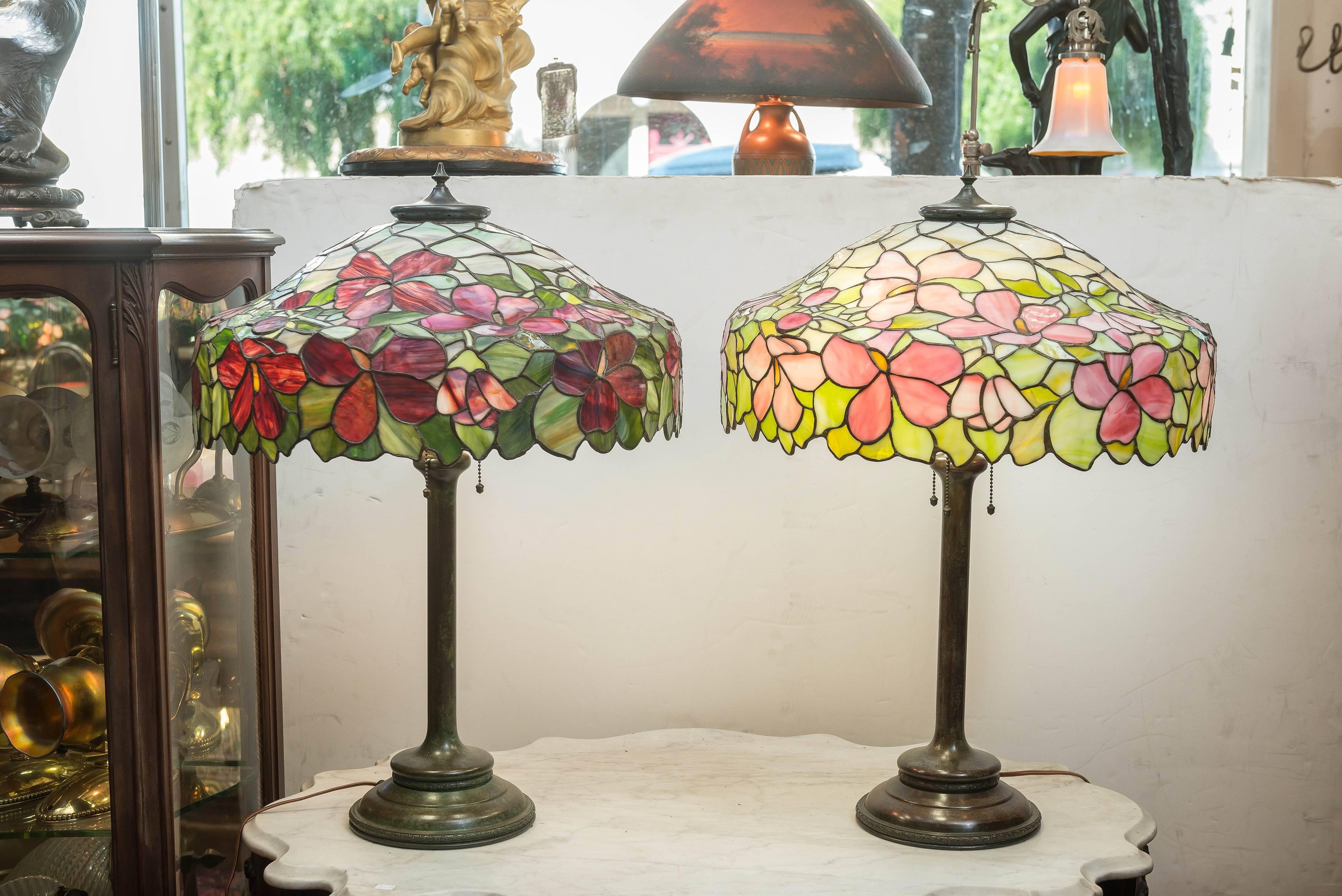 Offering a beautiful pair of lamps by a little known company to most people, but certainly well-known to the serious collector, the Unique Art Glass Co. Brooklyn N.Y.
The lamp with the red glass has some of the most dazzling glass you will see on
