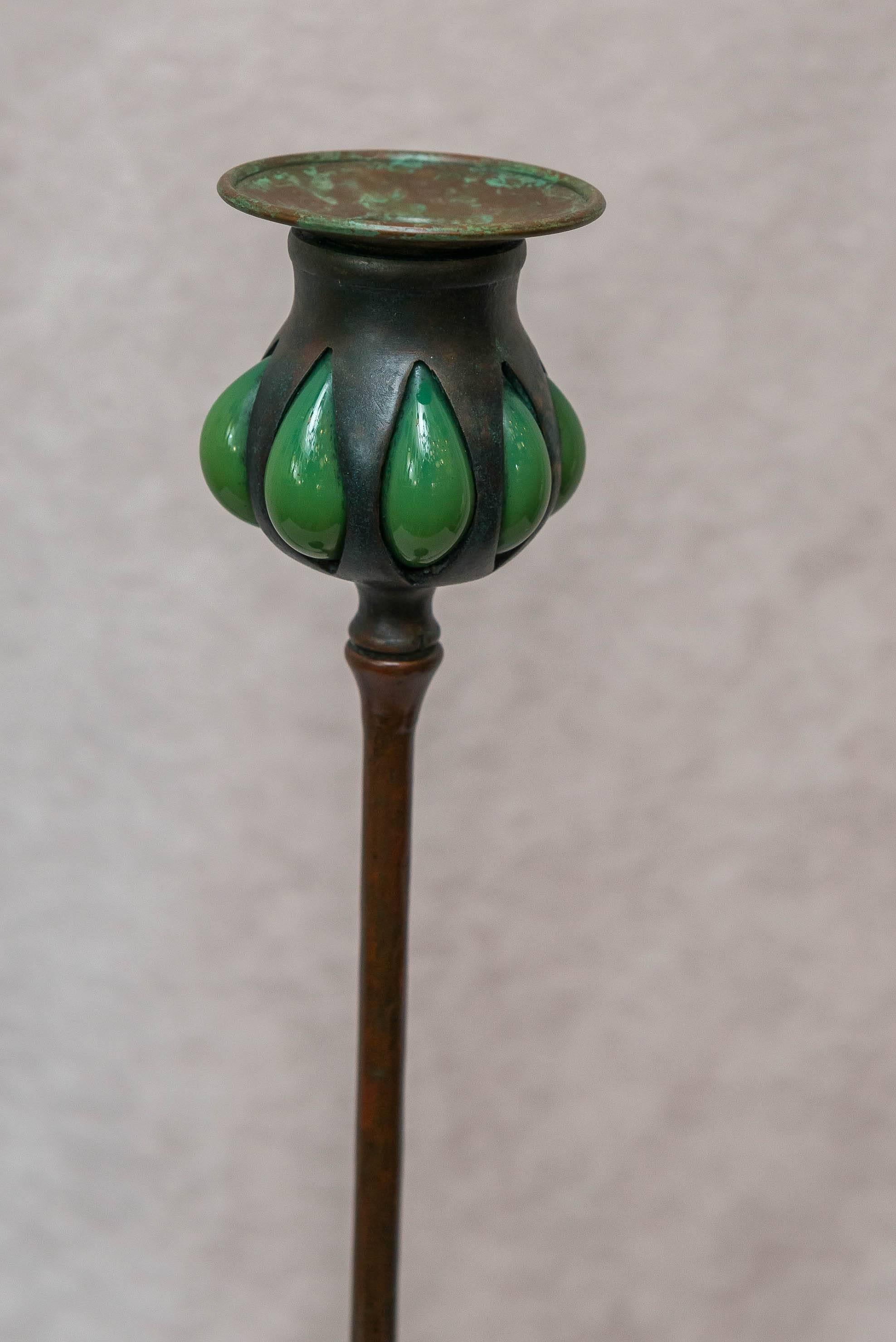 This tall and elegant Tiffany Studios candlestick would surely look wonderful in any home. Properly signed, and guaranteed to be a real period candlestick by this famous artist.

