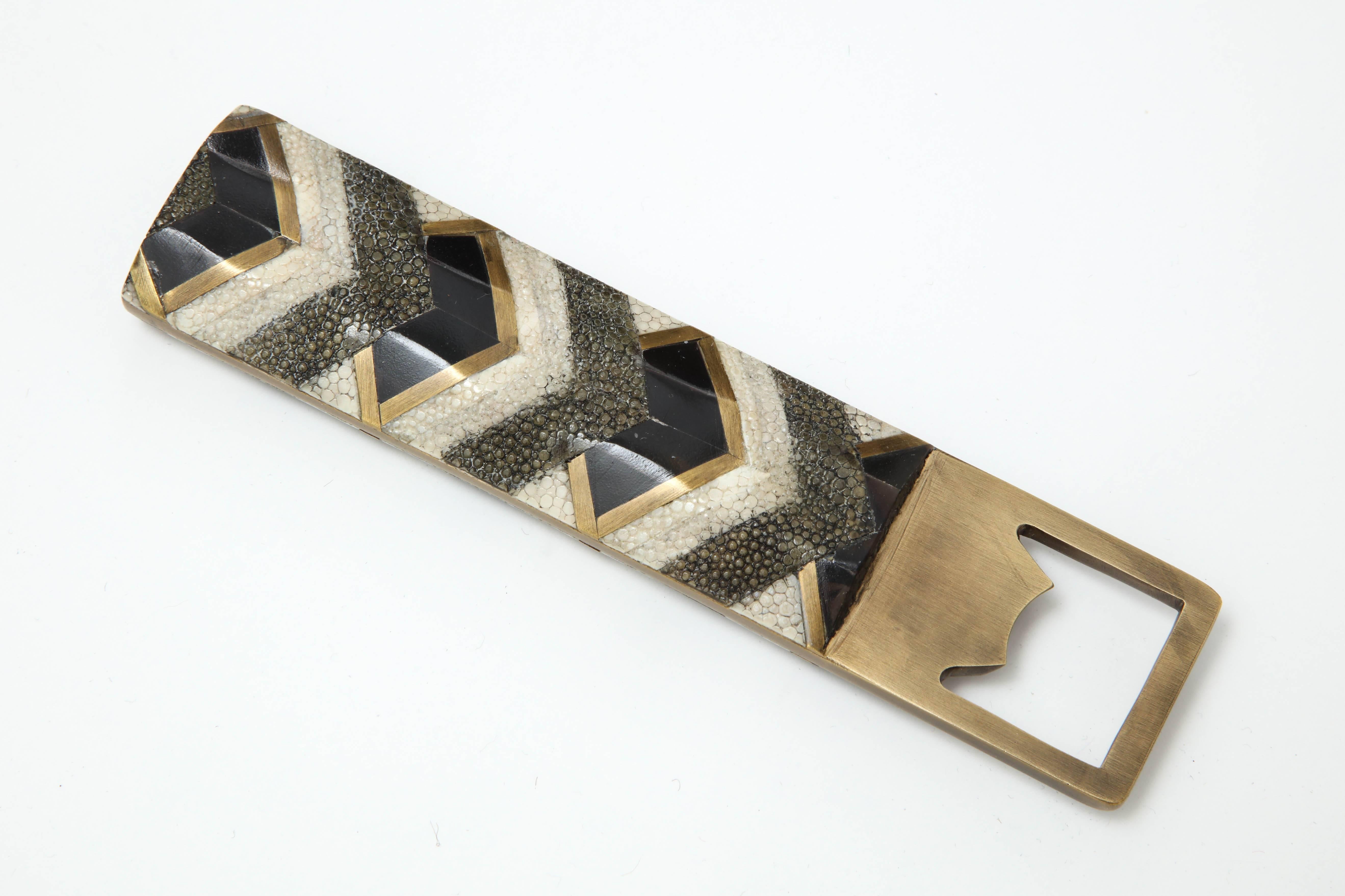 Decorative bottle opener made of different color shagreen and bronze details.