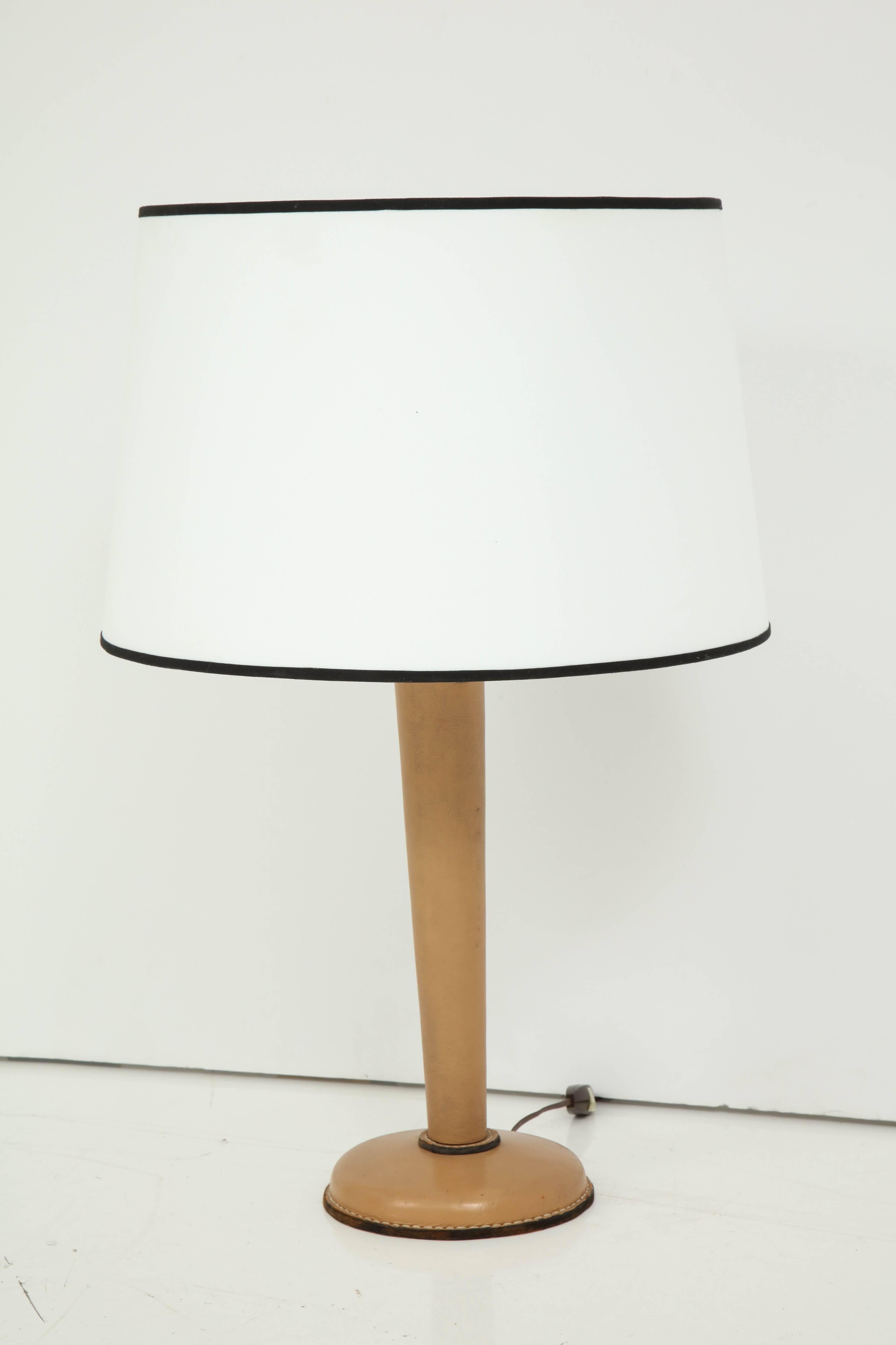 Tan stitched leather lamp by Jacques Adnet. Shade is for pictures and a custom one can be made on request. Base alone 7