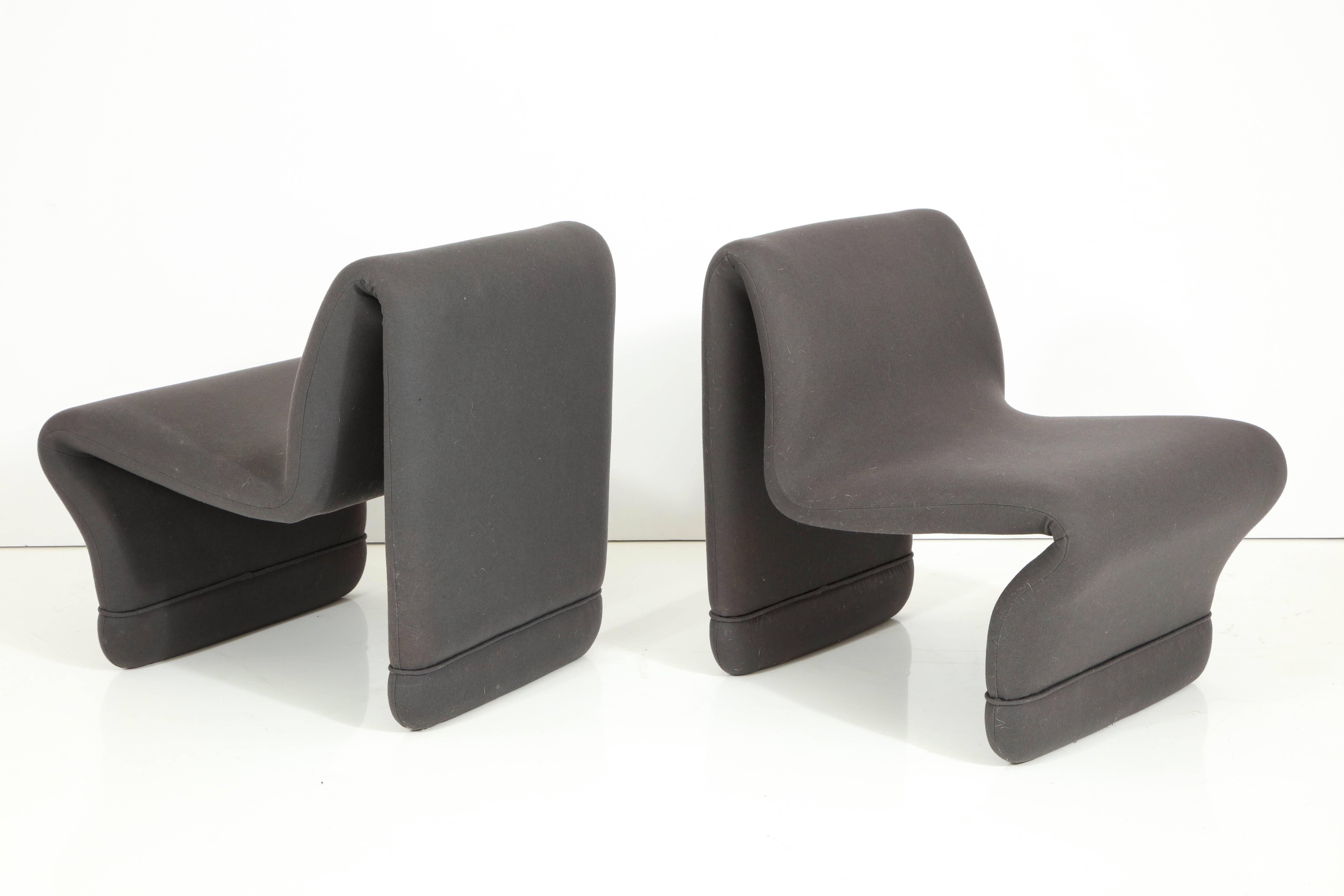 Pair of 1960s chairs designed by Olivia Morgue.
The chairs have recently been reupholstered in a grey wool fabric.
