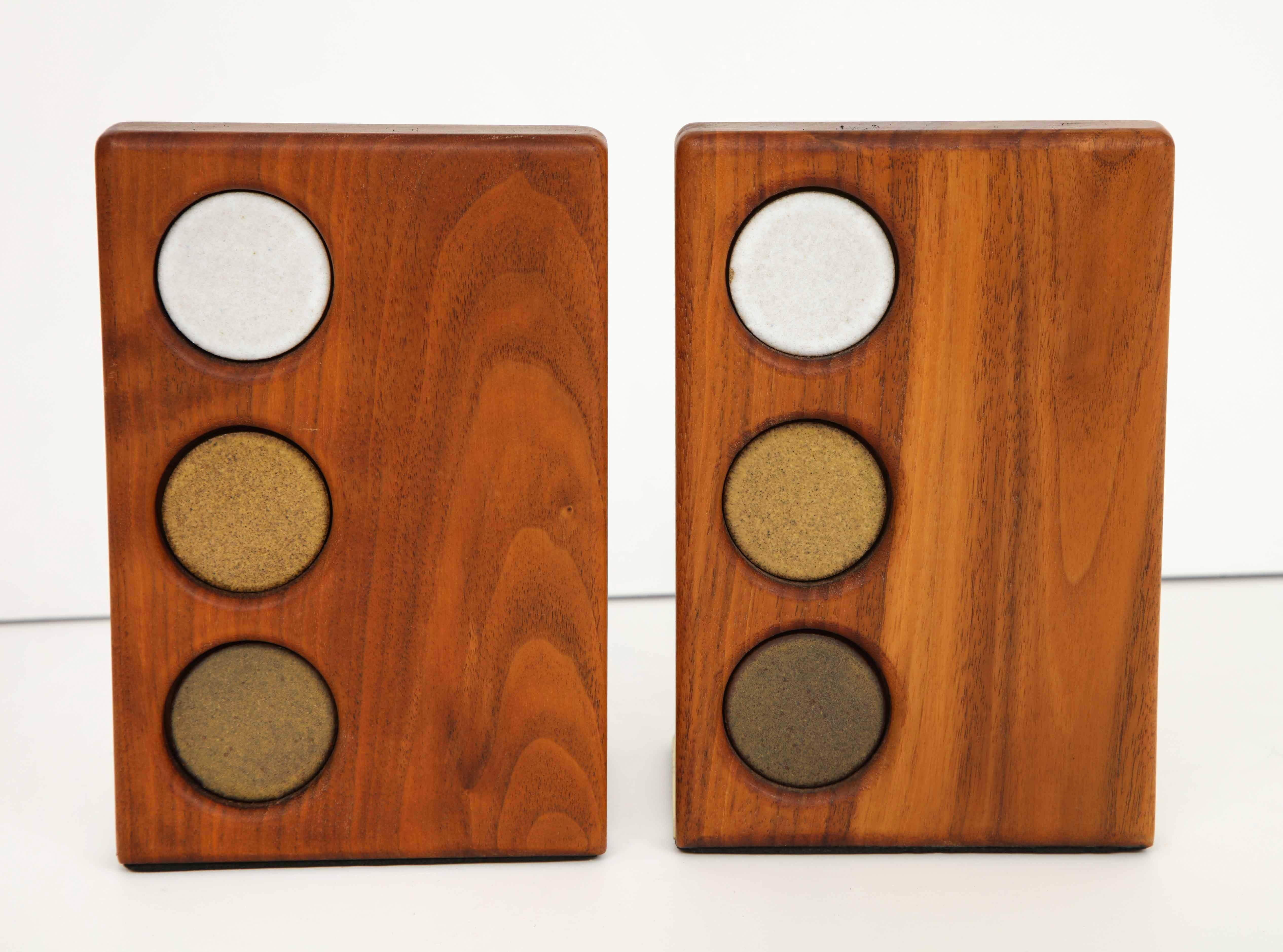 Midcentury pair of teak and brass bookends with ceramic dot inlay featuring Martz pottery classic colors of brown, tan and cream.