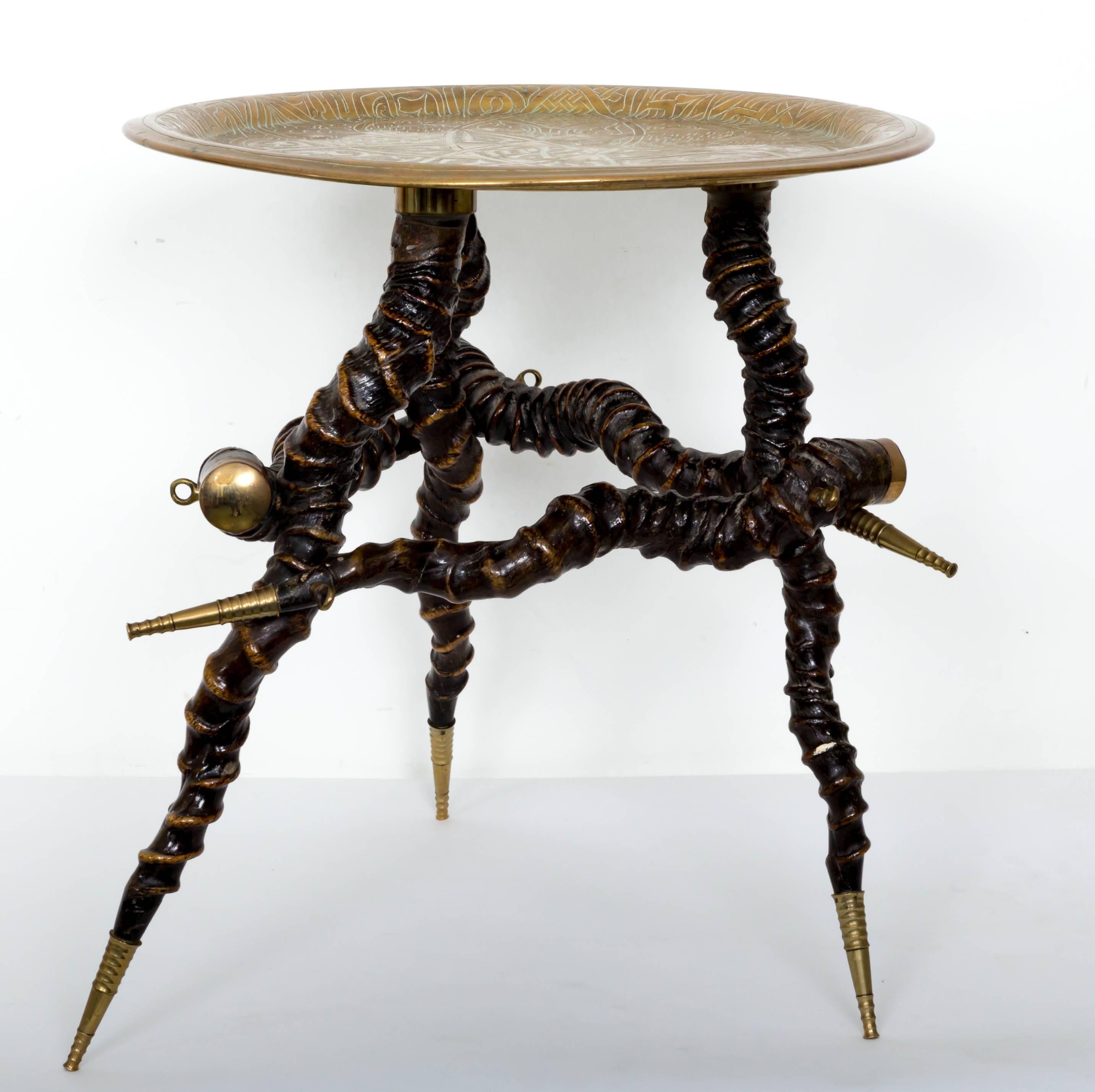 Twisted horn table possibly Impala horns with Indian engraved brass top. Brass tips on horns and brass tips on feet.