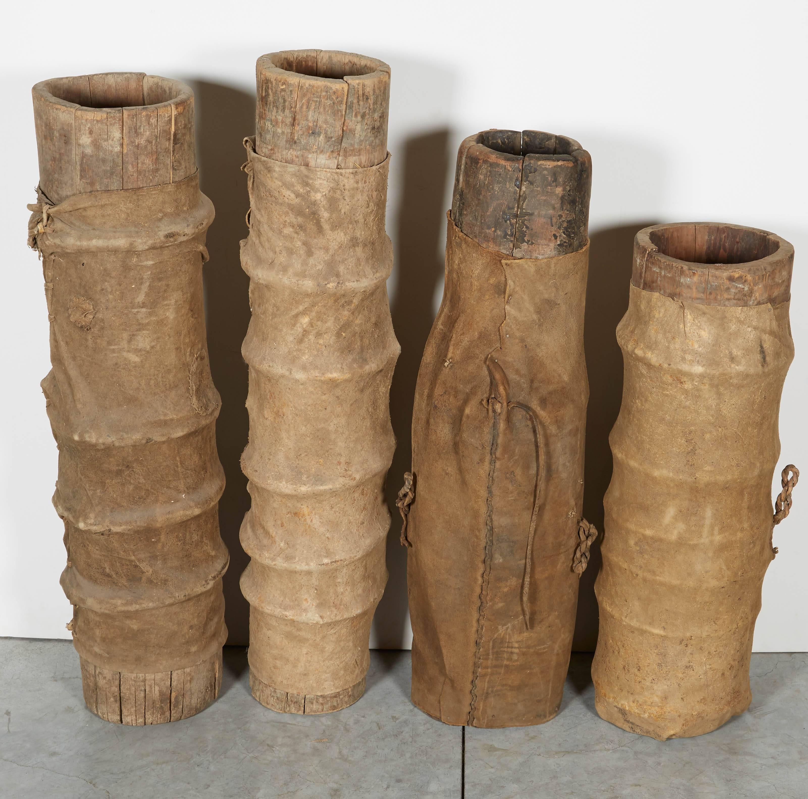 Four sculptural leather covered yak butter churns from Tibet.  The faded old leather coverings are crudely stitched with beautiful surfaces.  Great pieces rarely found with original leather covers. 

Priced and sold individually

2 pieces available.