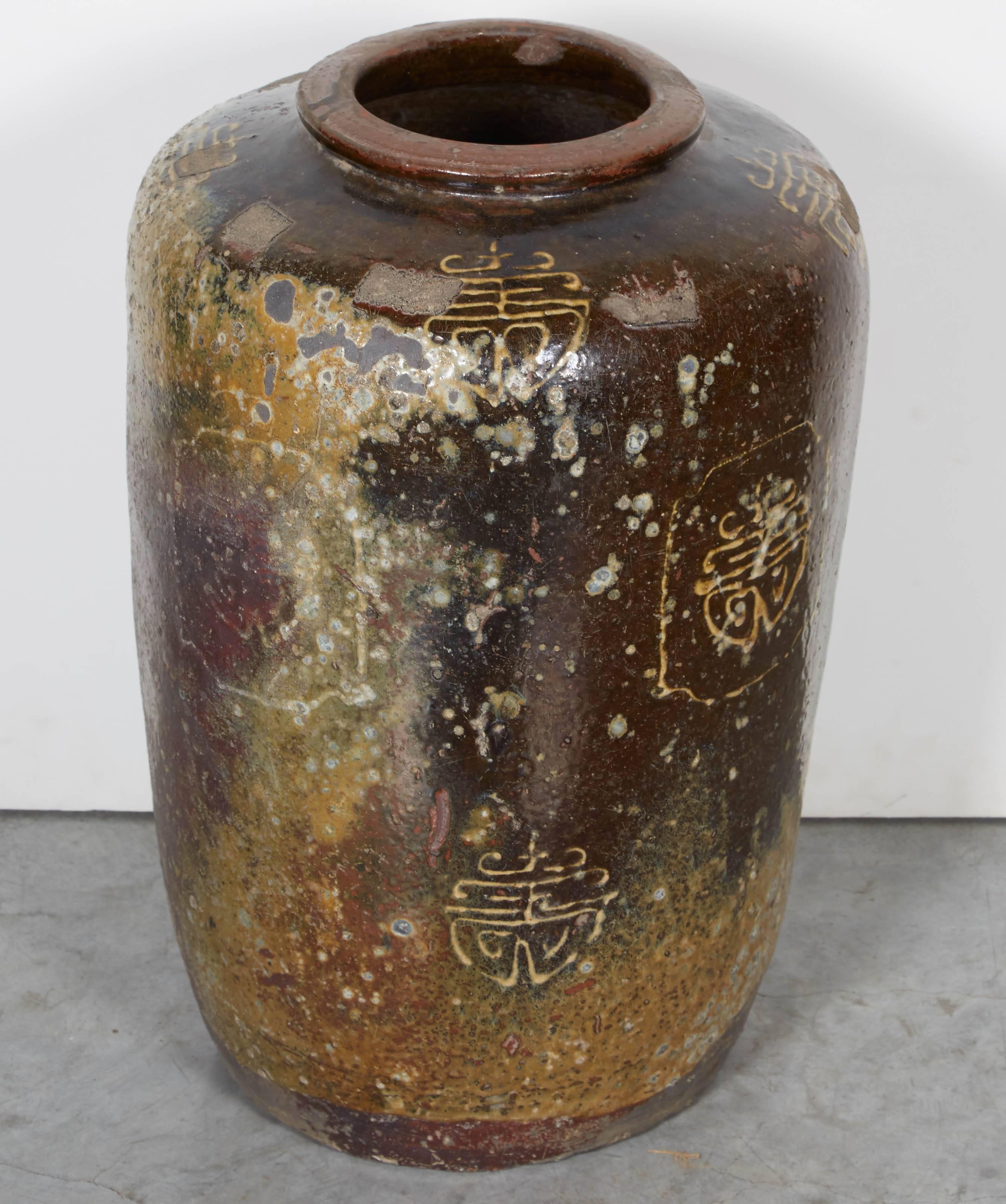 A beautifully weathered wine jar with Chinese characters. From Hunan Province, circa 1920. Several available. 
CR699.