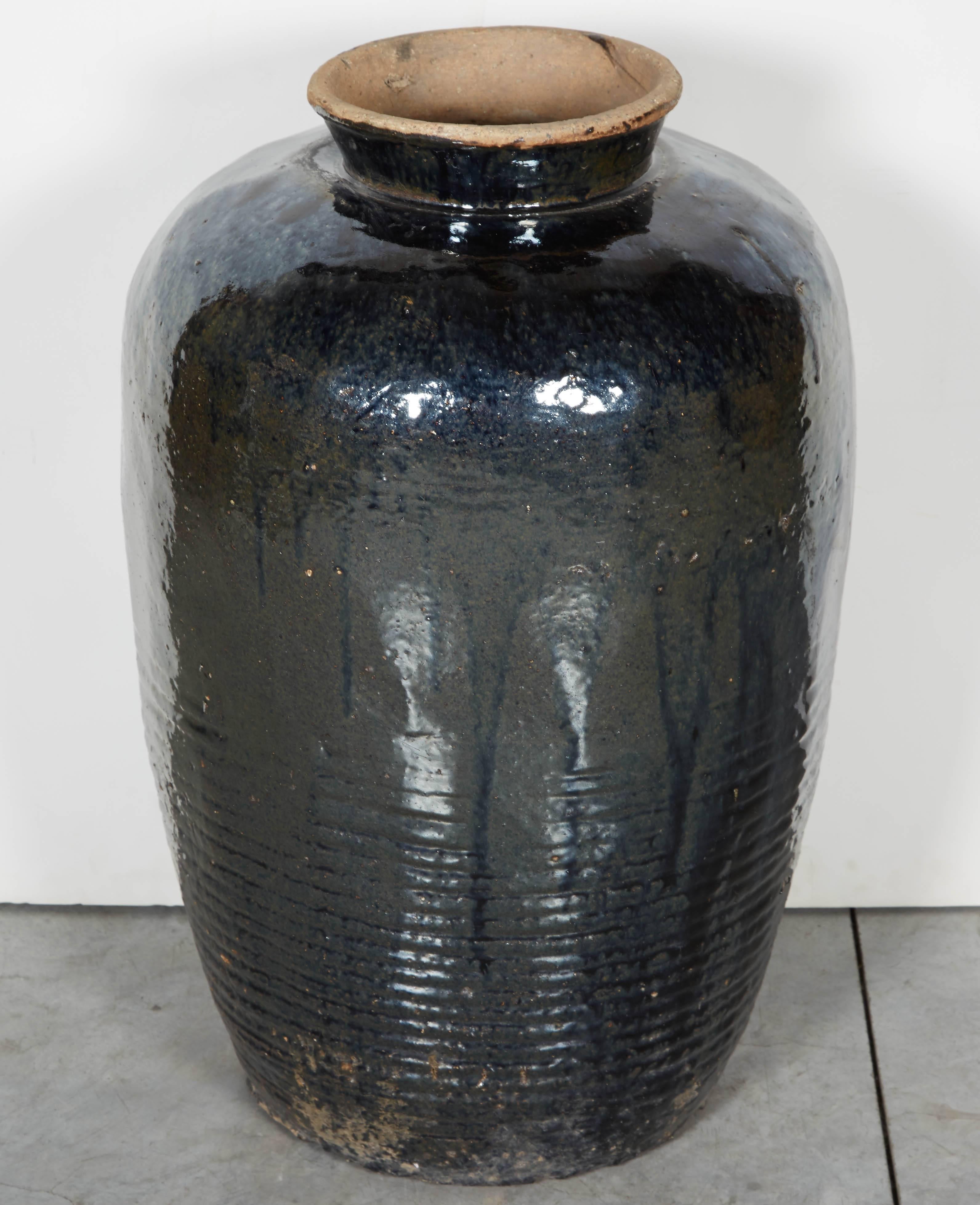 A large and gracefully shaped antique Chinese ceramic wine jar with great presence. This piece looks great on its own or with tall branches inside. From Shanxi Province, circa 1920.
CR714.