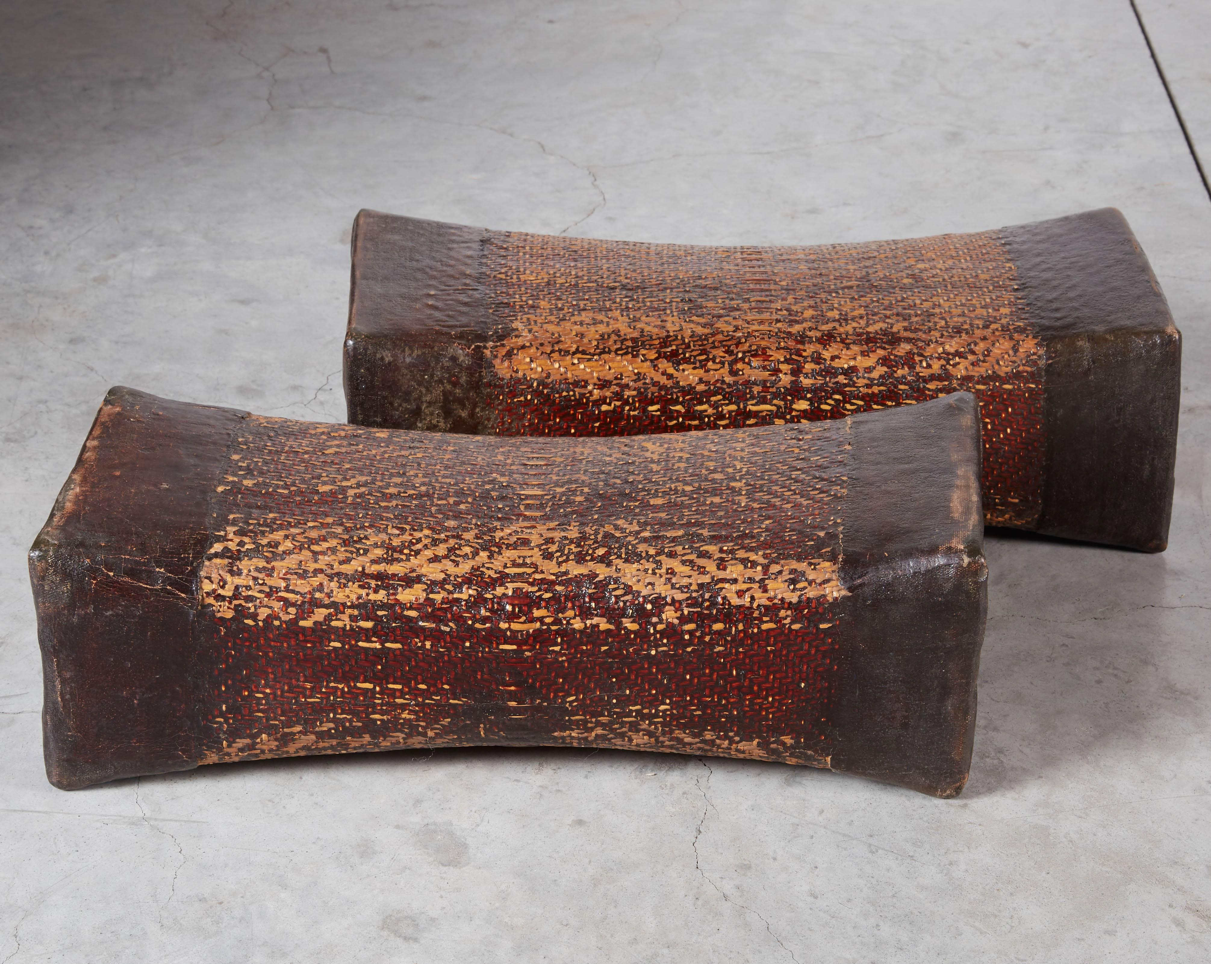 A beautiful pair of antique 16 inch long woven willow and lacquer pillows from Shanxi Province, China. These gracefully shaped objects have a glorious patina and are in great condition.
M928.