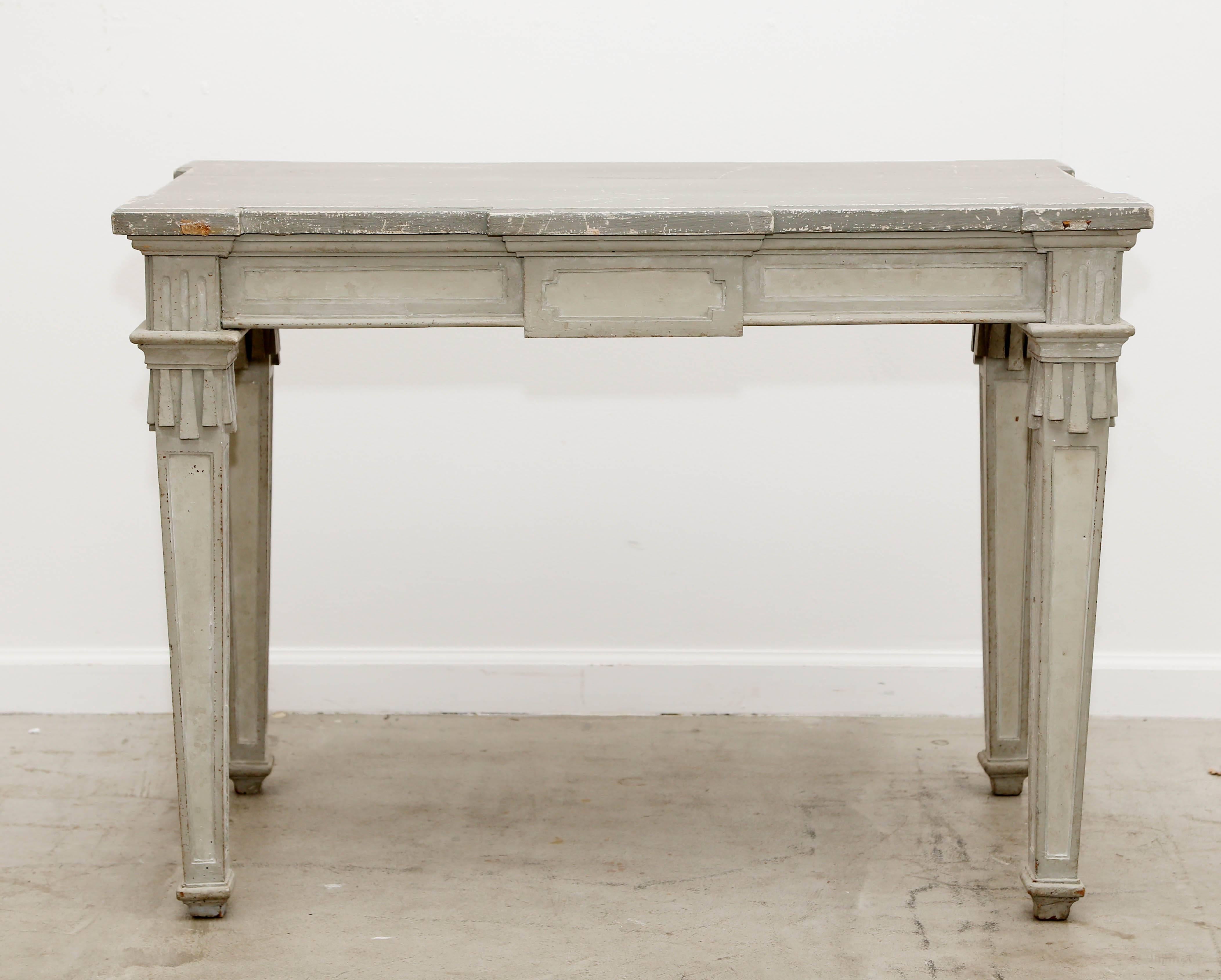 Antique Swedish period Gustavian painted console table early 19th century distressed painted on top in a darker grey with original scratches, cracks and marks and layers of original paint. Apron adorned with rectangular ornaments carving around