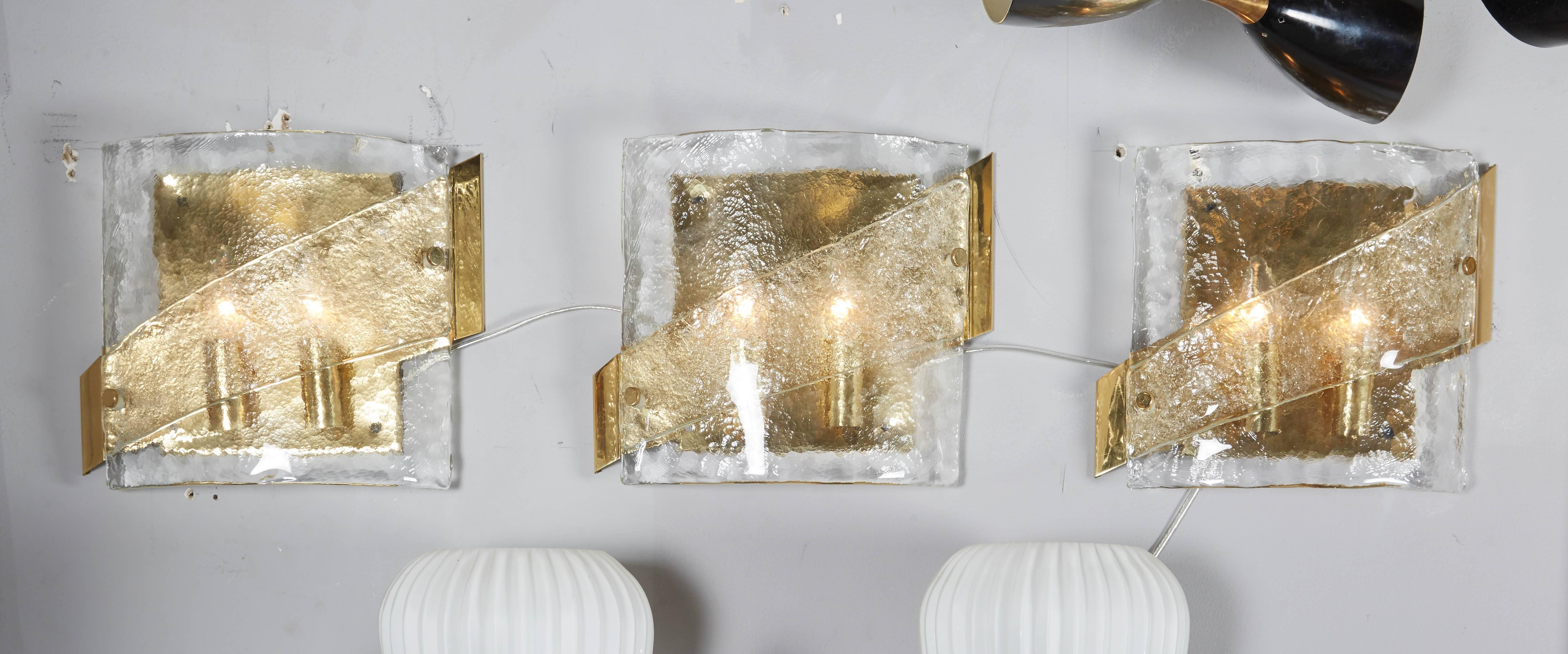 1970's Kalmar glass sconce with brass frame. 3 pieces available for immediate purchase.