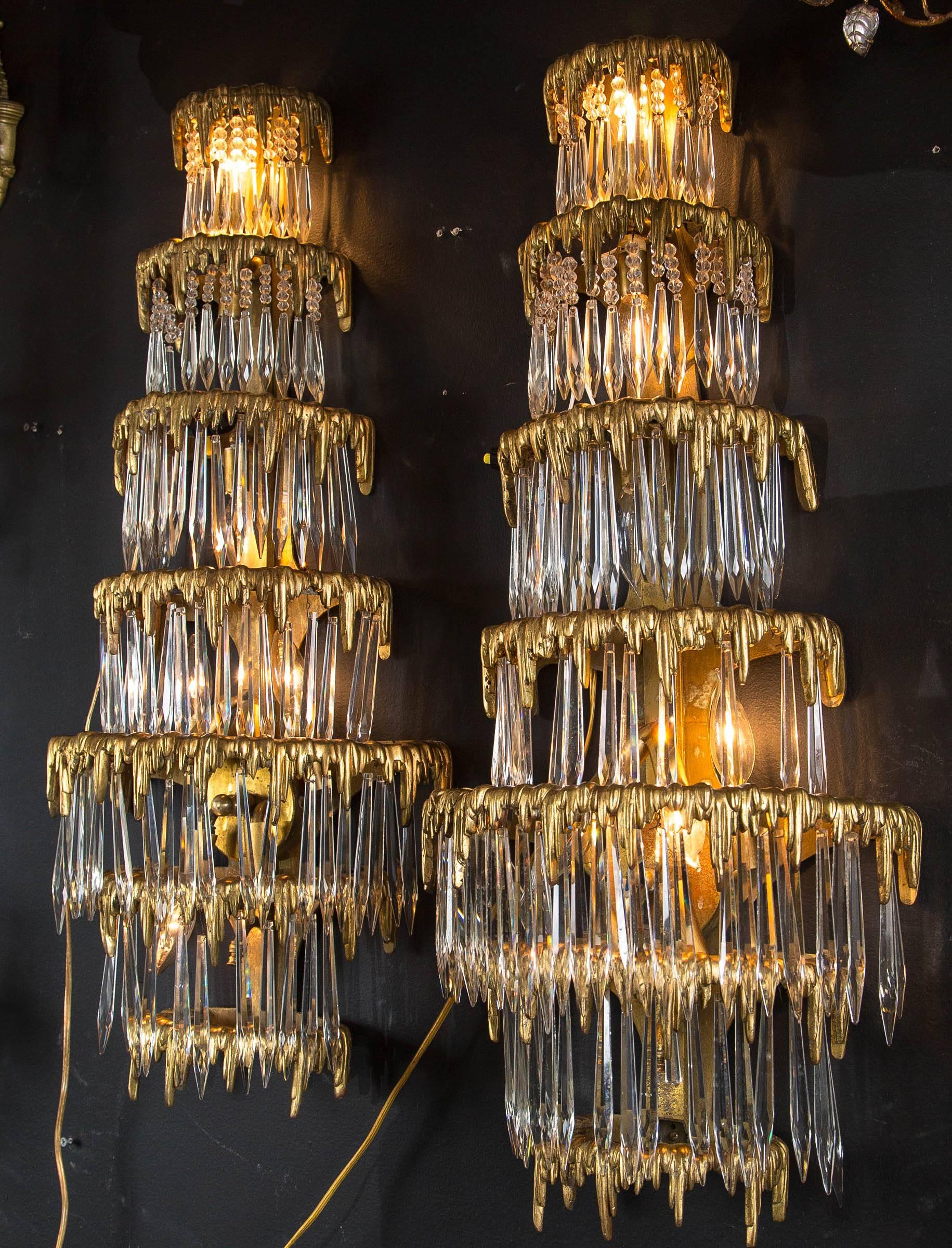 A pair of large circa 1920 Caldwell gilt bronze sconces with crystal hanging from Marshall Field fam. State in Aspen.