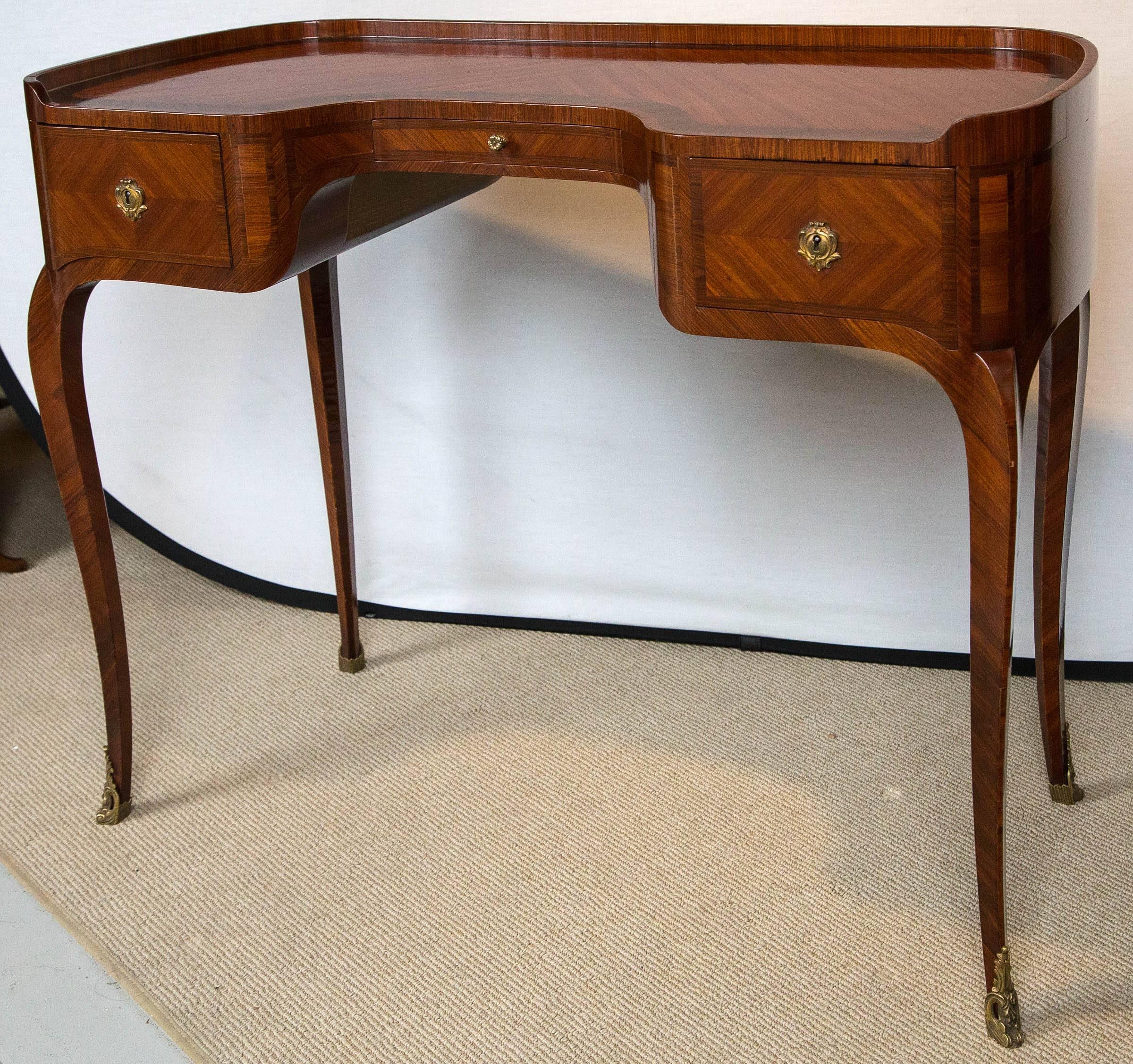 A French desk with banding, circa 1900s.