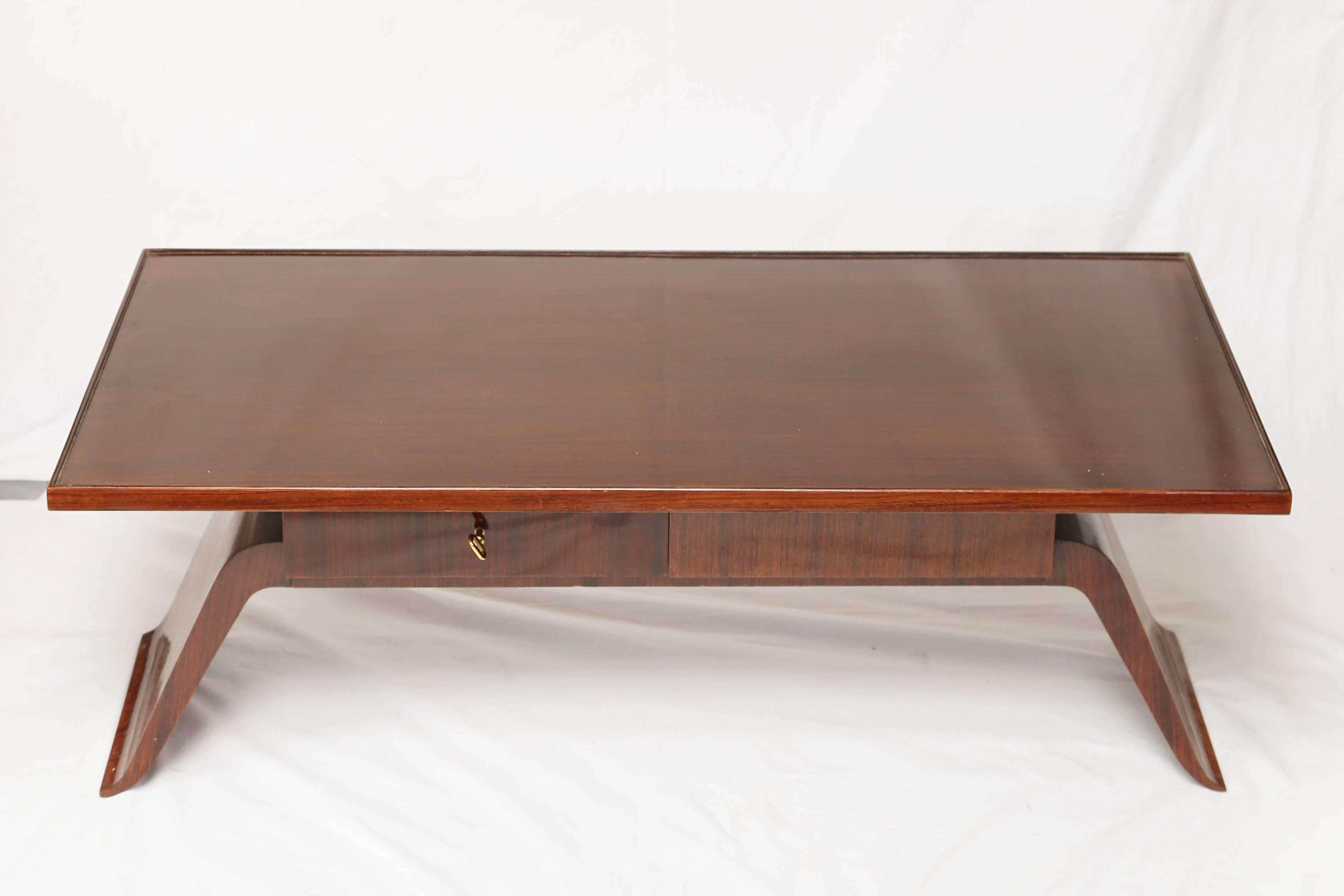 A beautiful and sophisticate rosewood partner coffee table with one drawers on each sides with key.