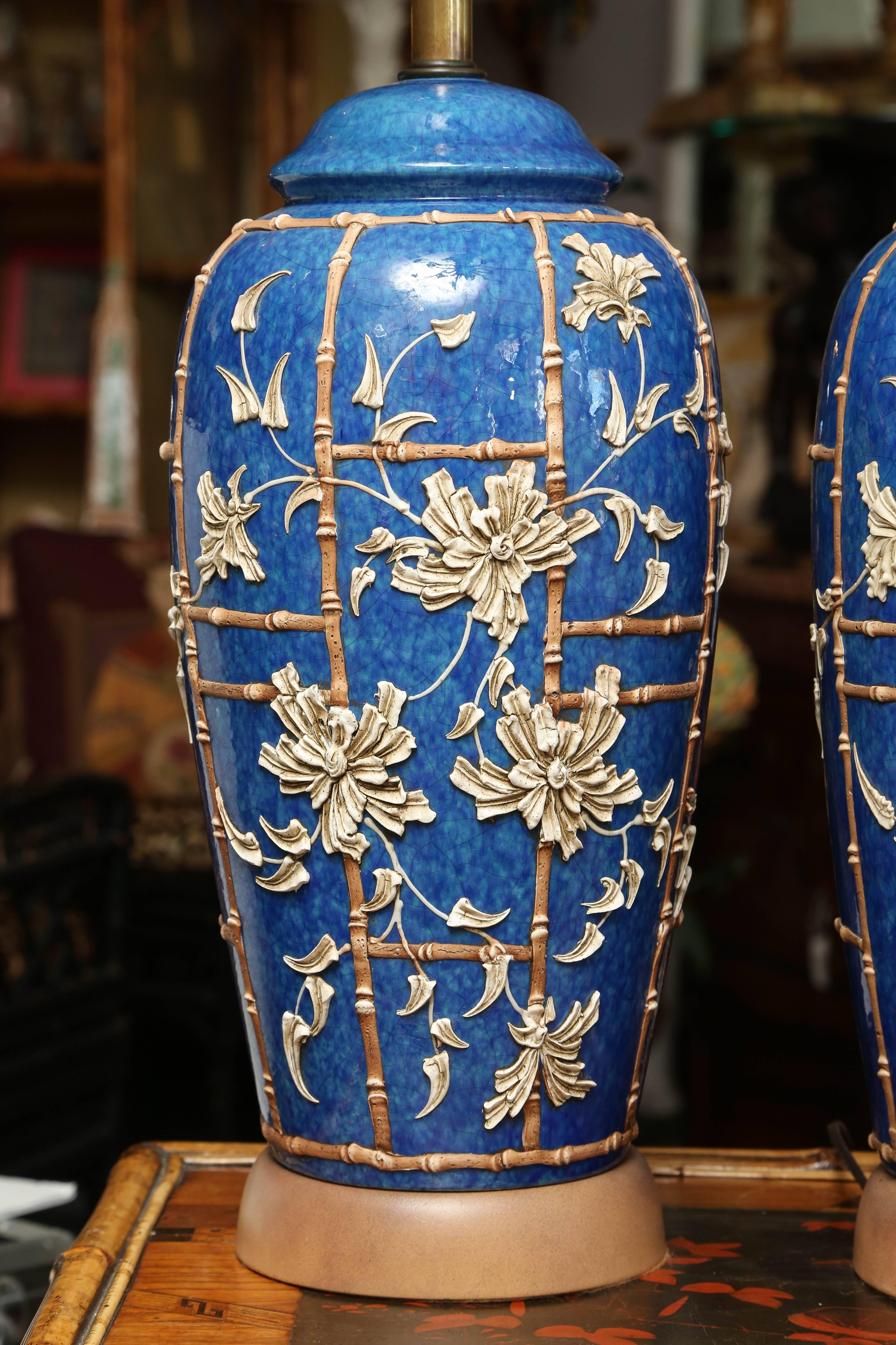 Early 20th century jars with raised floral.
A fine pair appointed with bamboo motif 