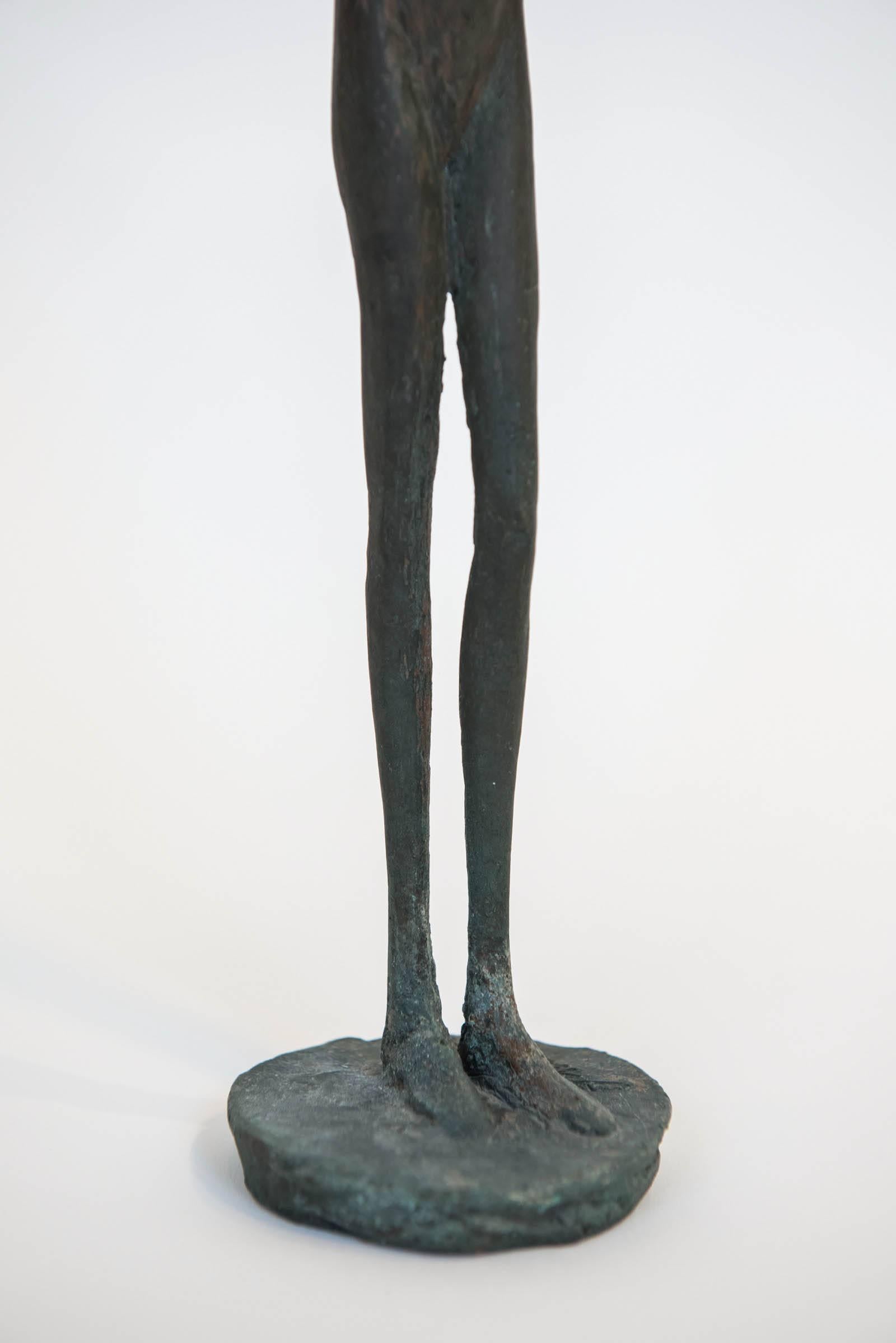 This tall and elegant bronze is signed at the base J. Culiner. He is a well known listed Canadian sculptor (1913-2013) whose work is prominent in many prominent Toronto homes and outdoor installations. This rare nude is a typical of the artists work