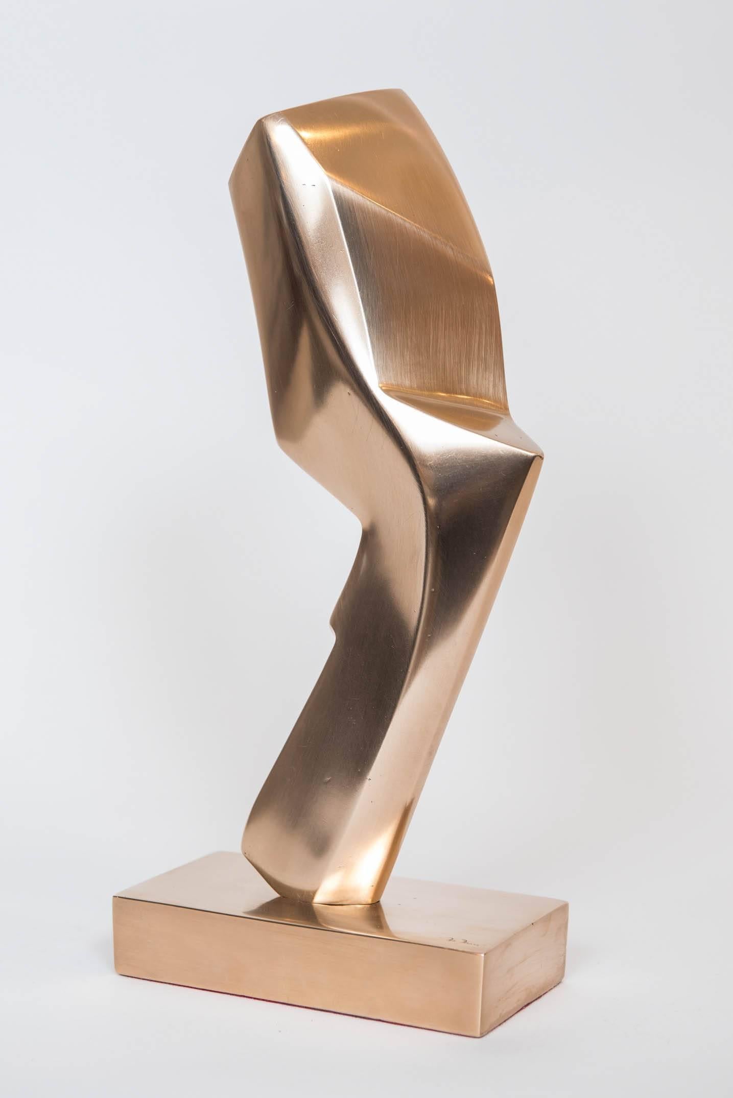 This simple, imposing and monolithic polished bronze sculpture is signed M. Marx on the base and on the lower part of the sculpture. It measures 13