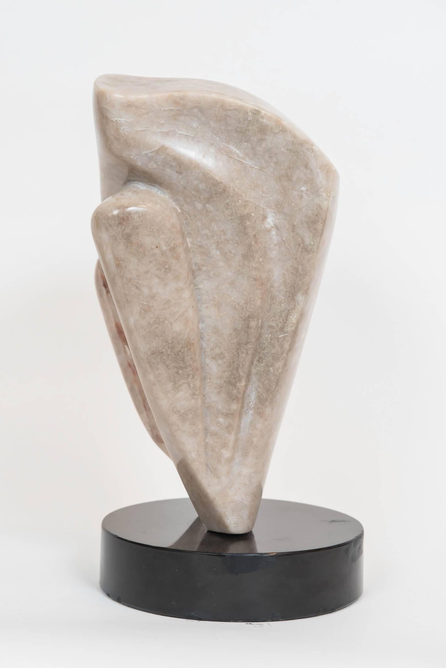 This great decorative abstract marble sculpture is mounted on a ebonized 8