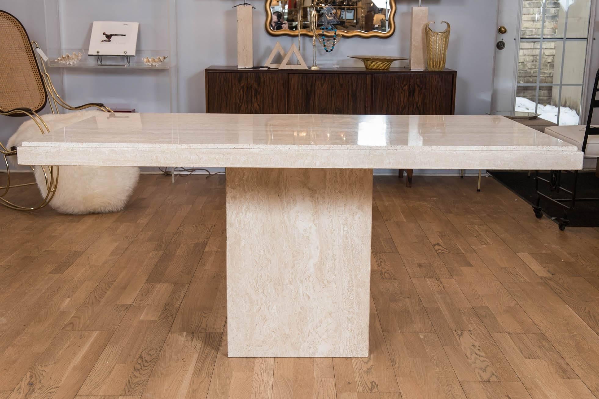 This handsome simple yet stylish vintage custom travertine limestone table is perfect as a breakfast table, desk or center hall piece. The double edged step-back top fits snuggly on a single pedestal and can be removed for transportation.