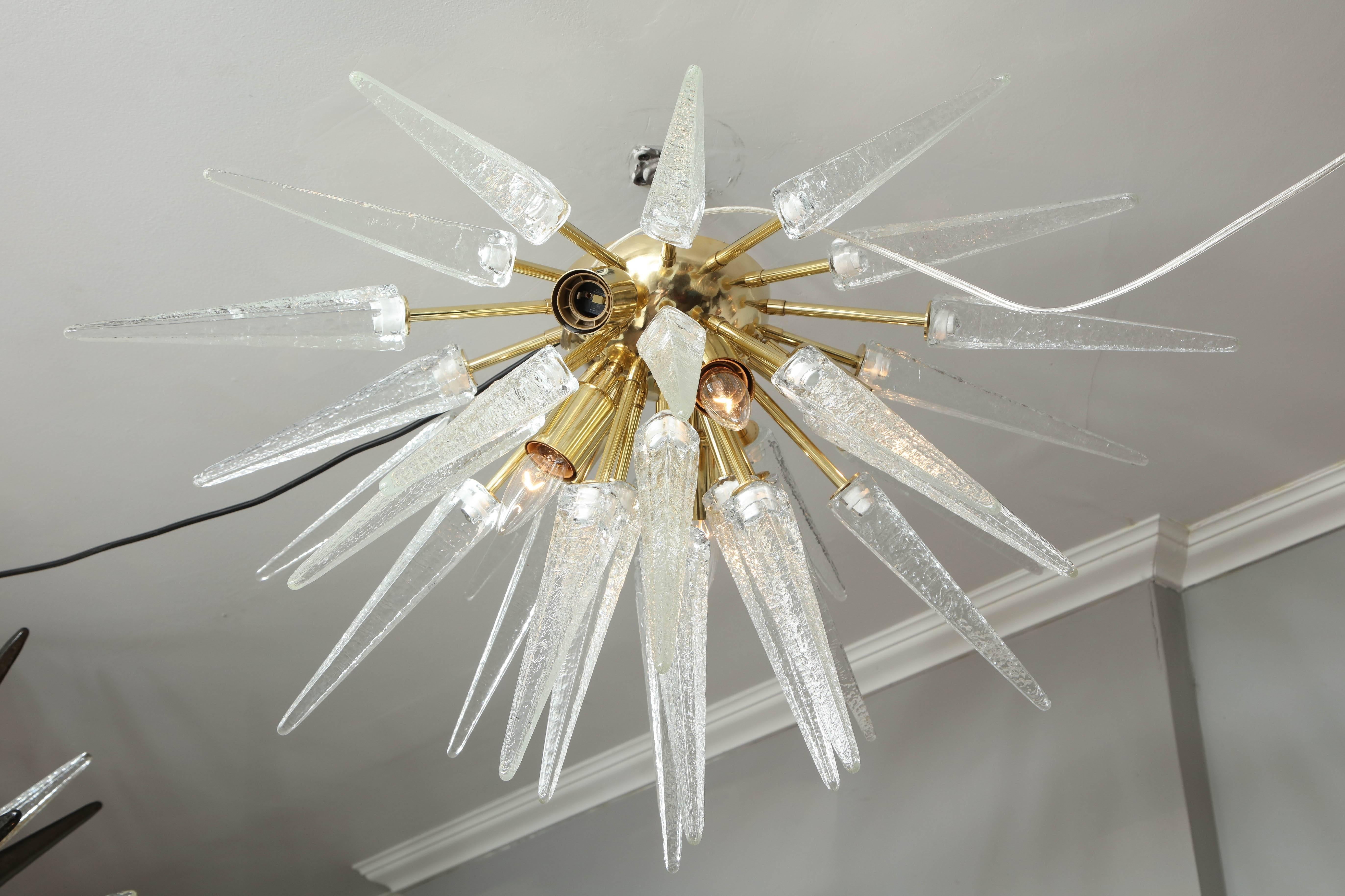 Custom clear Murano glass spike sputnik flush mount in polished brass finish. Customization is available in different sizes, glass colors, and finishes.