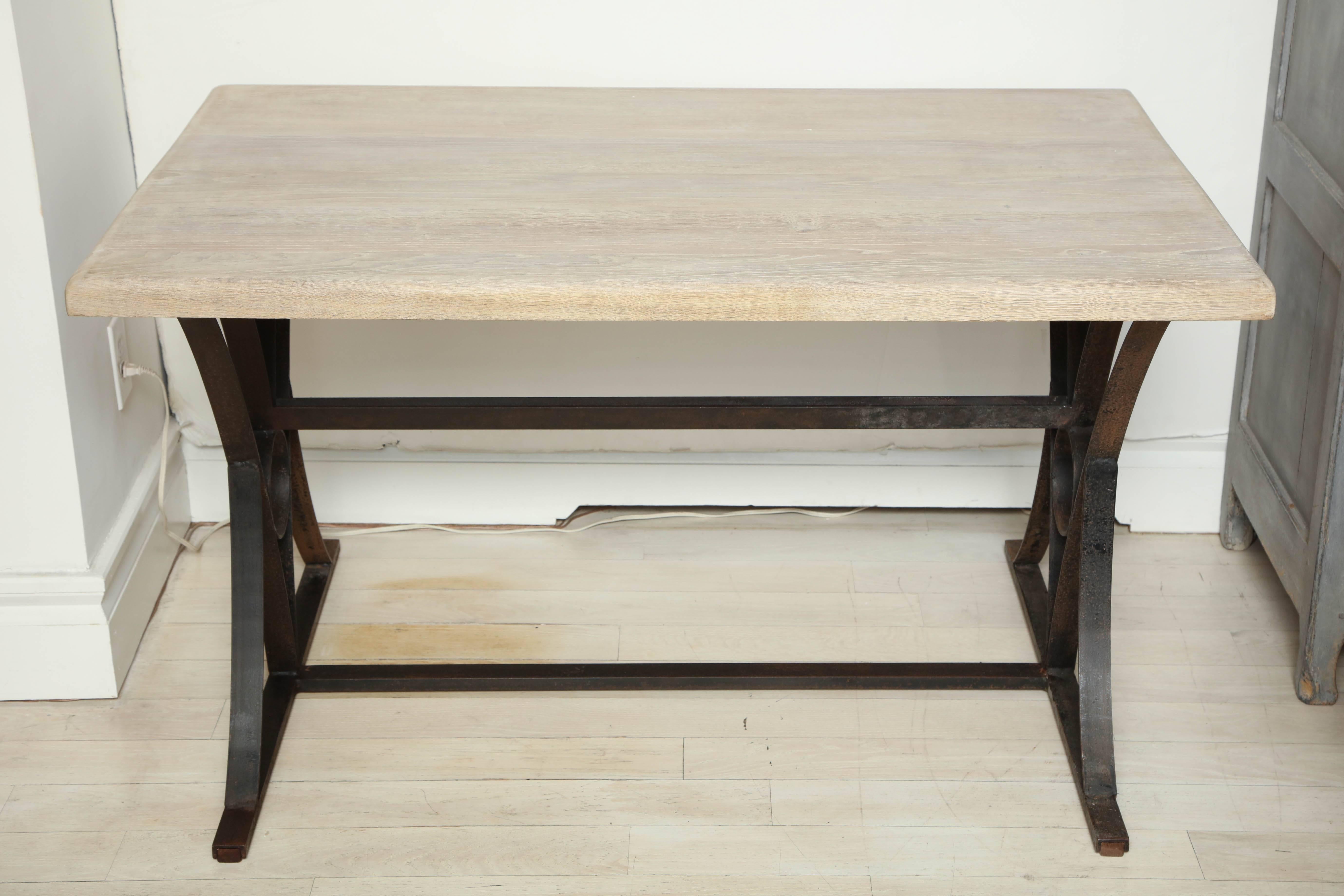 Table or desk with iron base and bleached oak top, Belgium, circa 1940s.