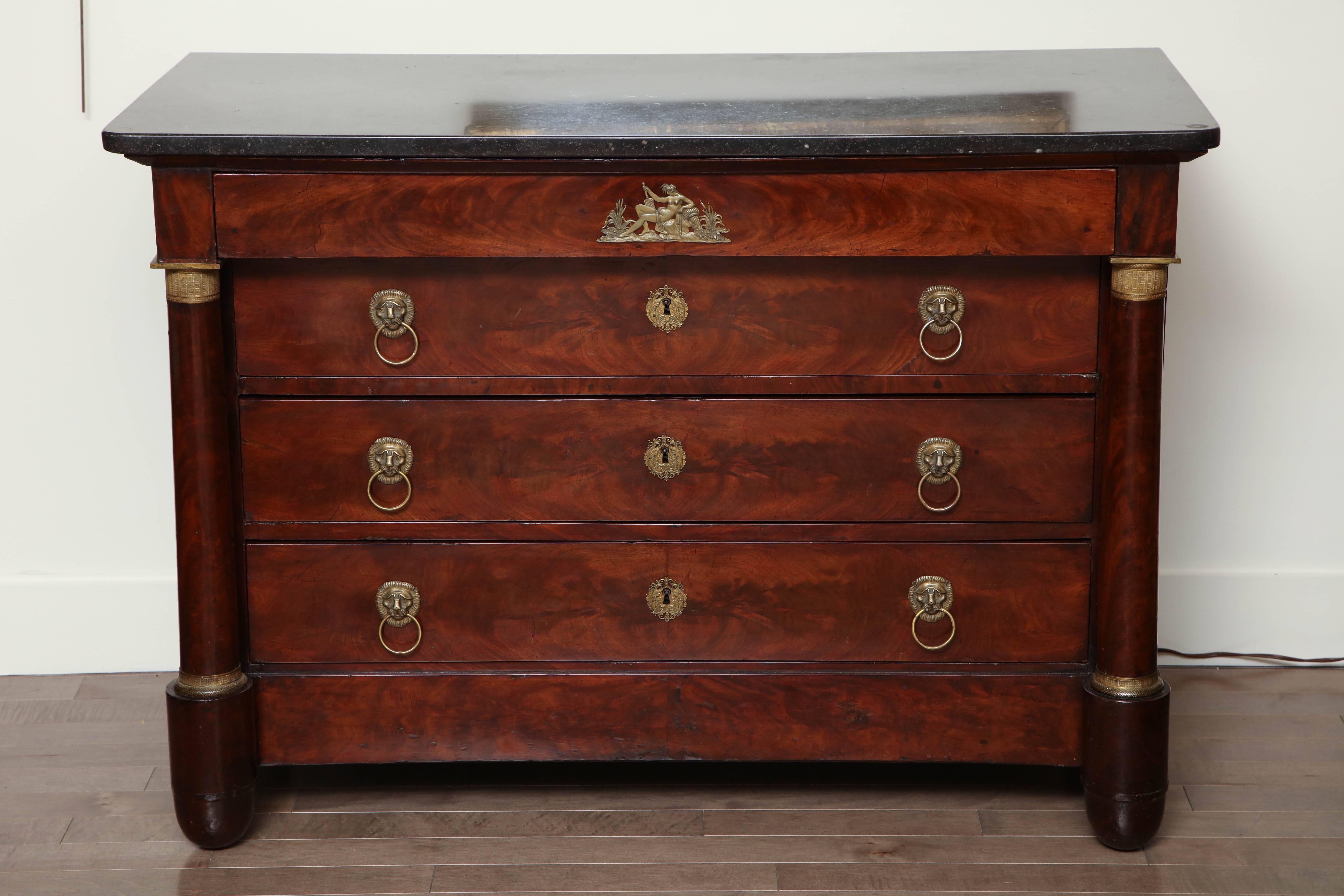 Early 19th century French Empire chest in mahogany with ormolu mounts and a petite granite top.