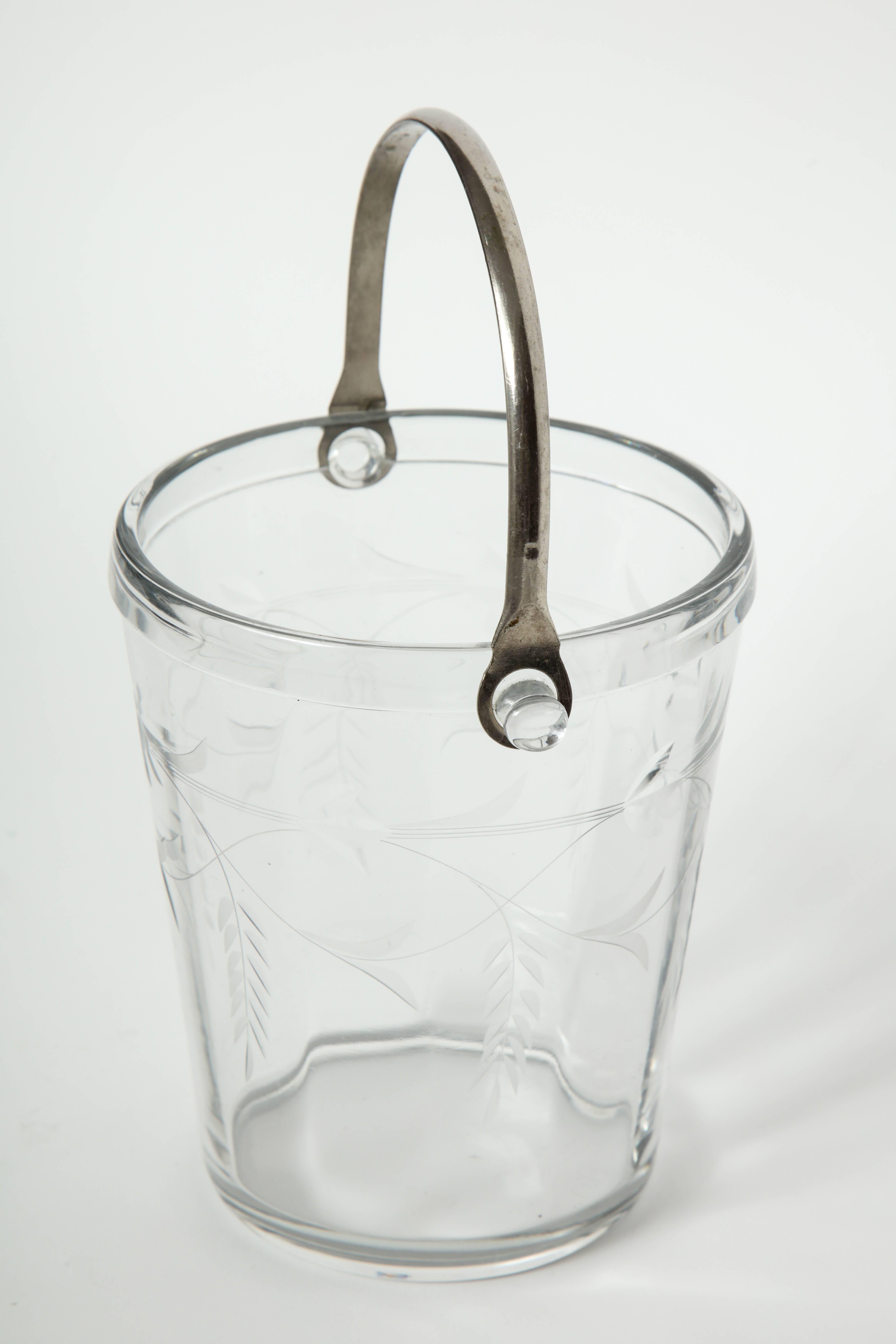 French Art Deco period ice bucket with a hand etched stylized floral/vine pattern and a silver handle.