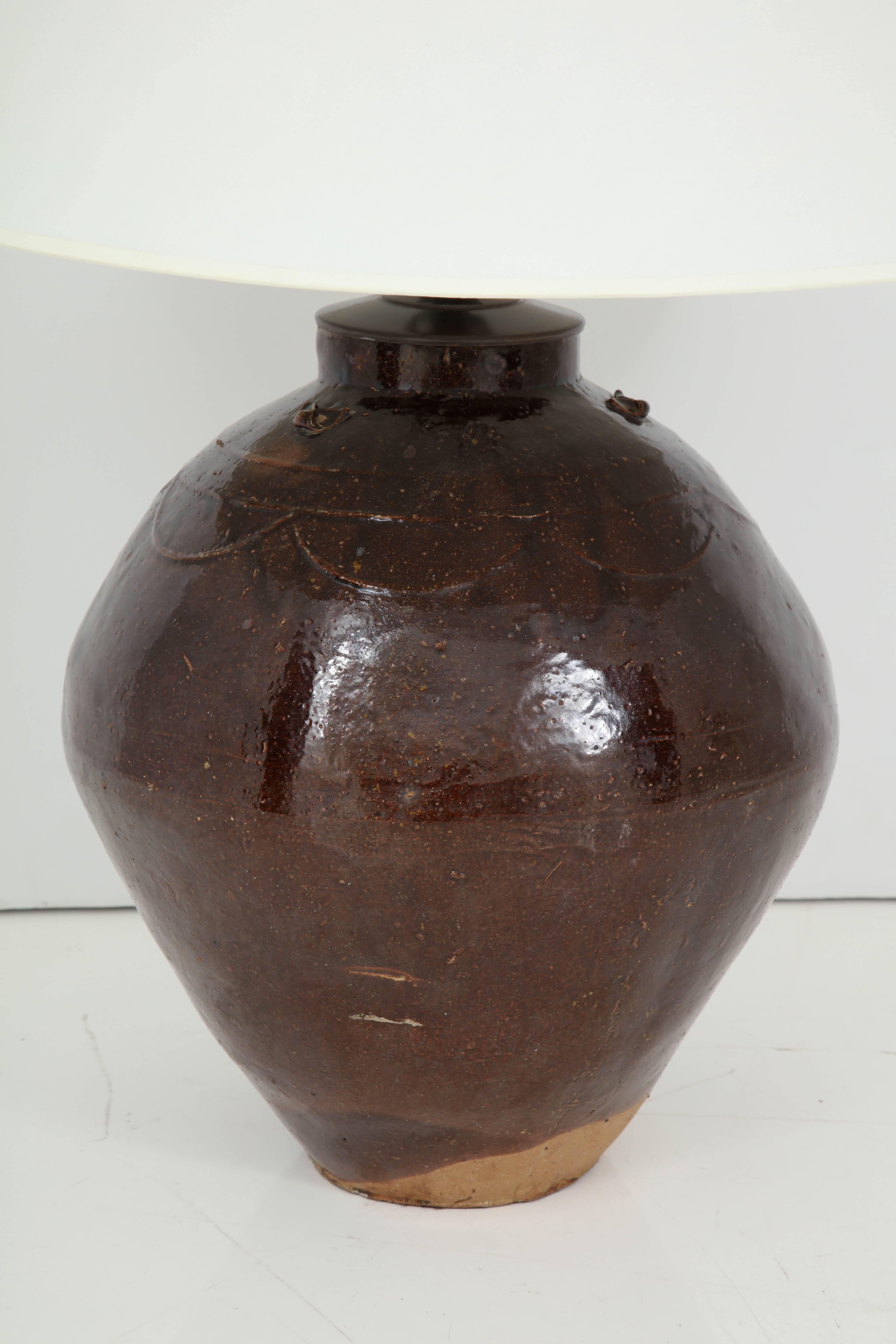 Late 19th century brown glazed terracotta wine vessel lamp.