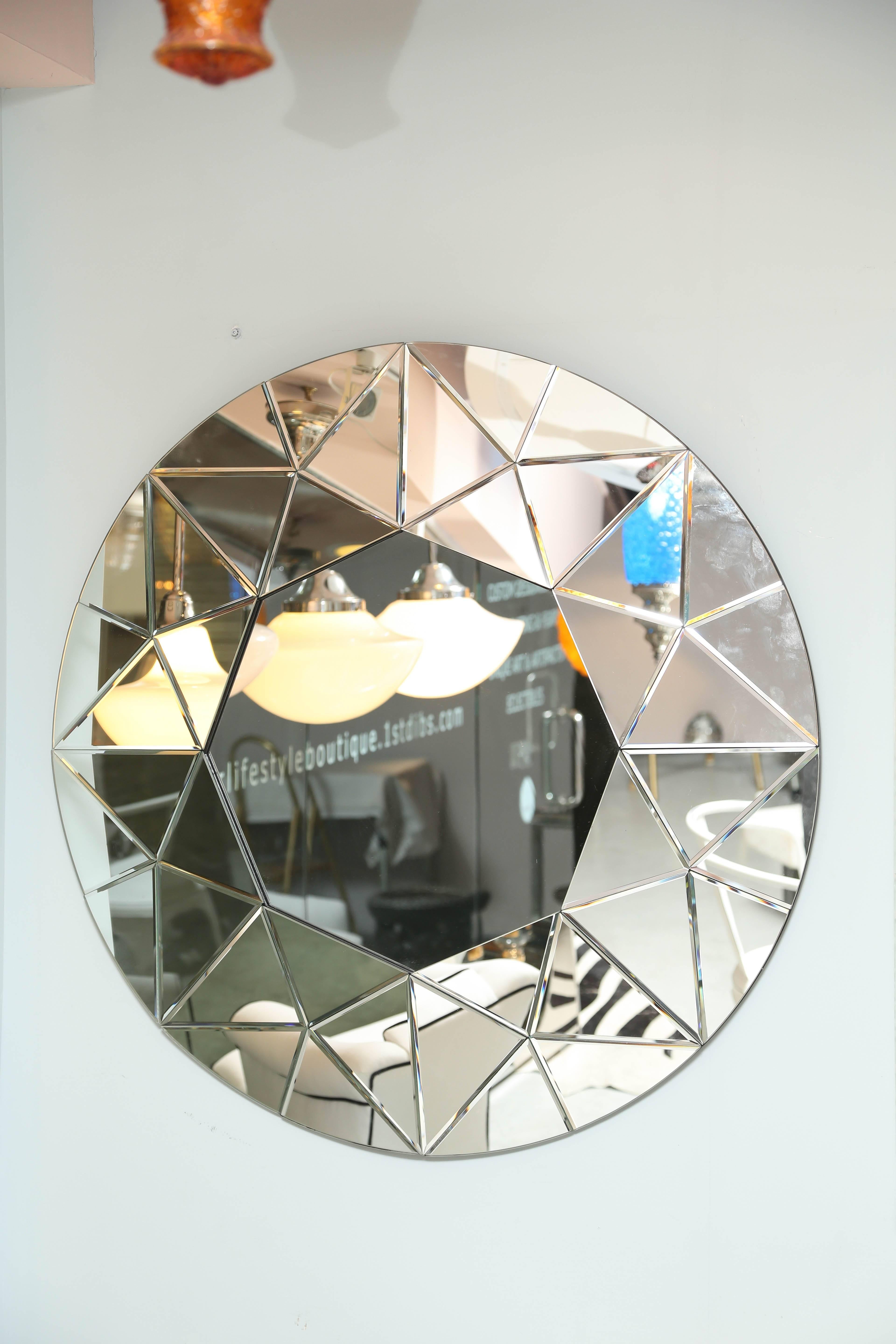 This mirror will add great elegance to either a contemporary or traditional room. Measures: 40 in.ORIG