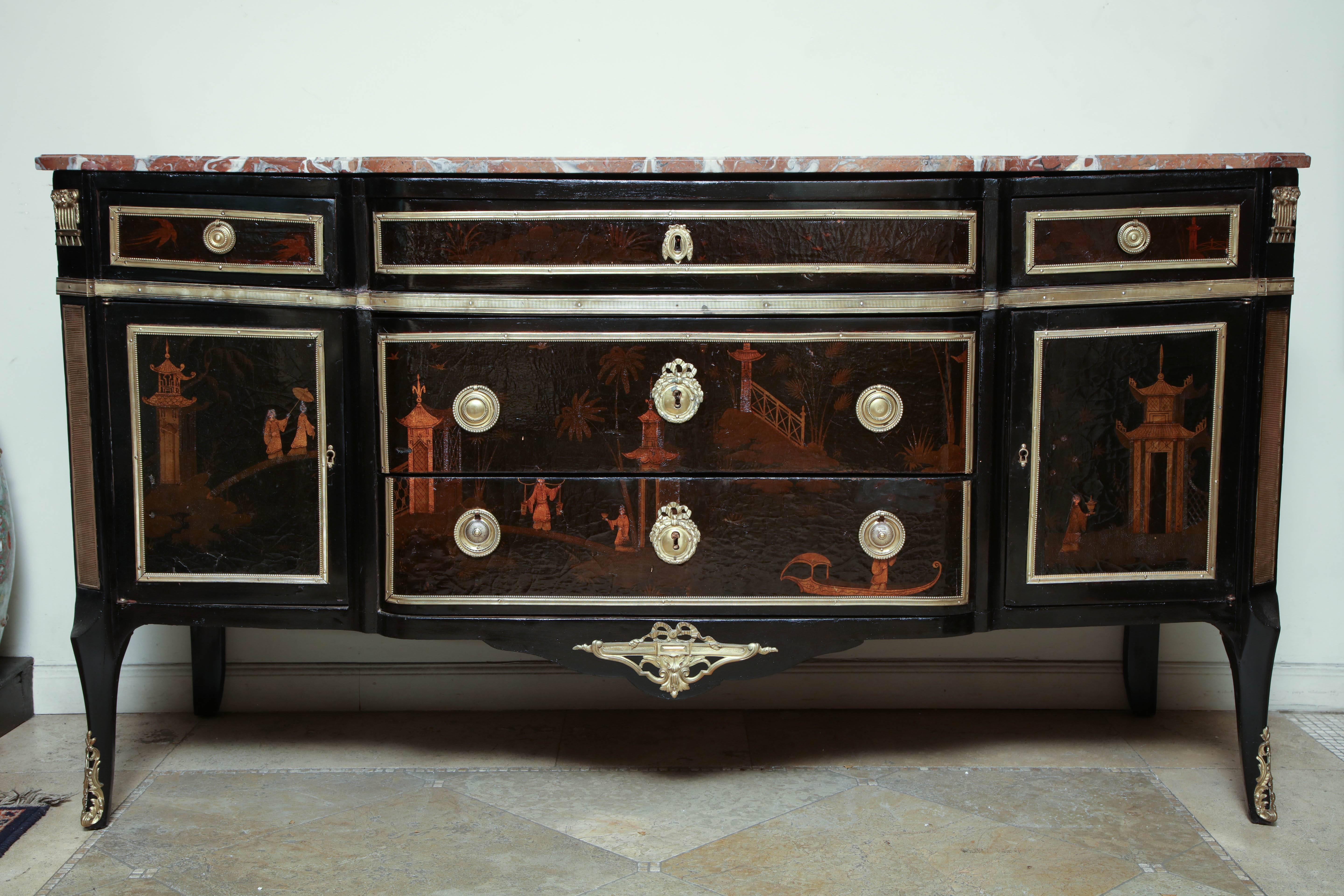 A fine French Transitional Louis XV / XVI marble-top block front commode with black lacquered chinoiserie decoration and bronze mounts.