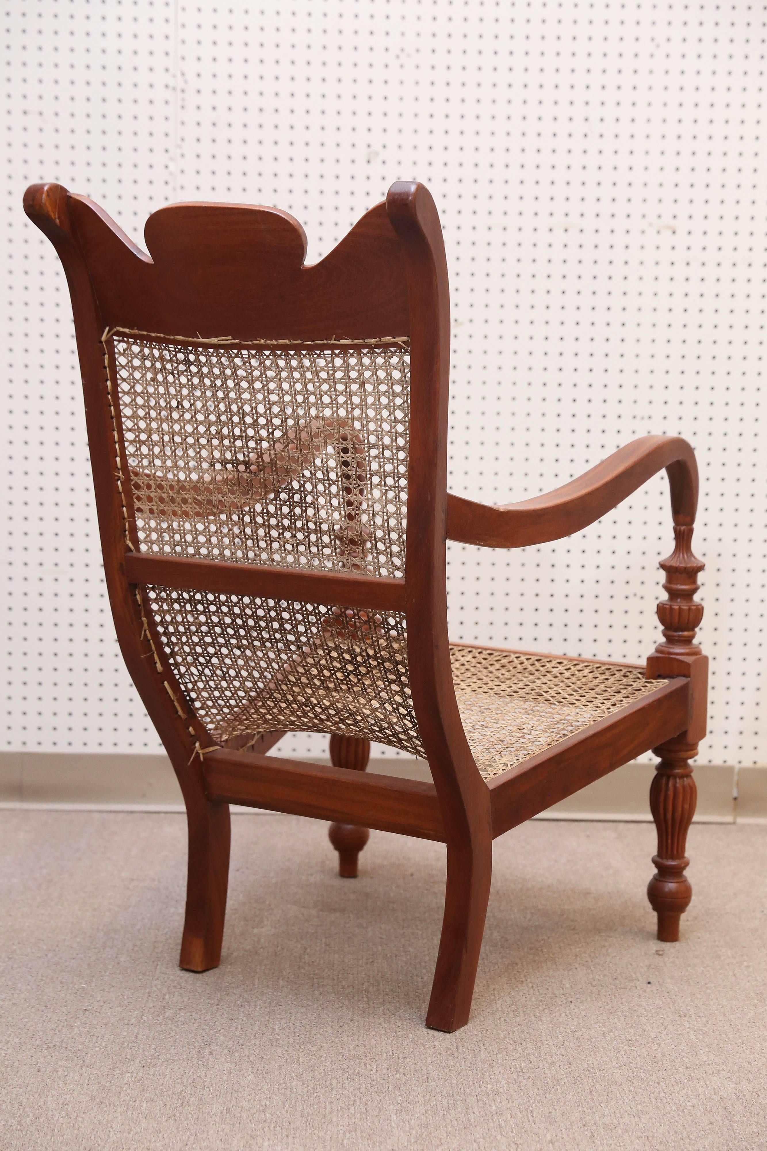 Anglo Raj Set of Four Teak Wood and Cane Lounge Chairs from Colombo Area of Sri Lanka For Sale