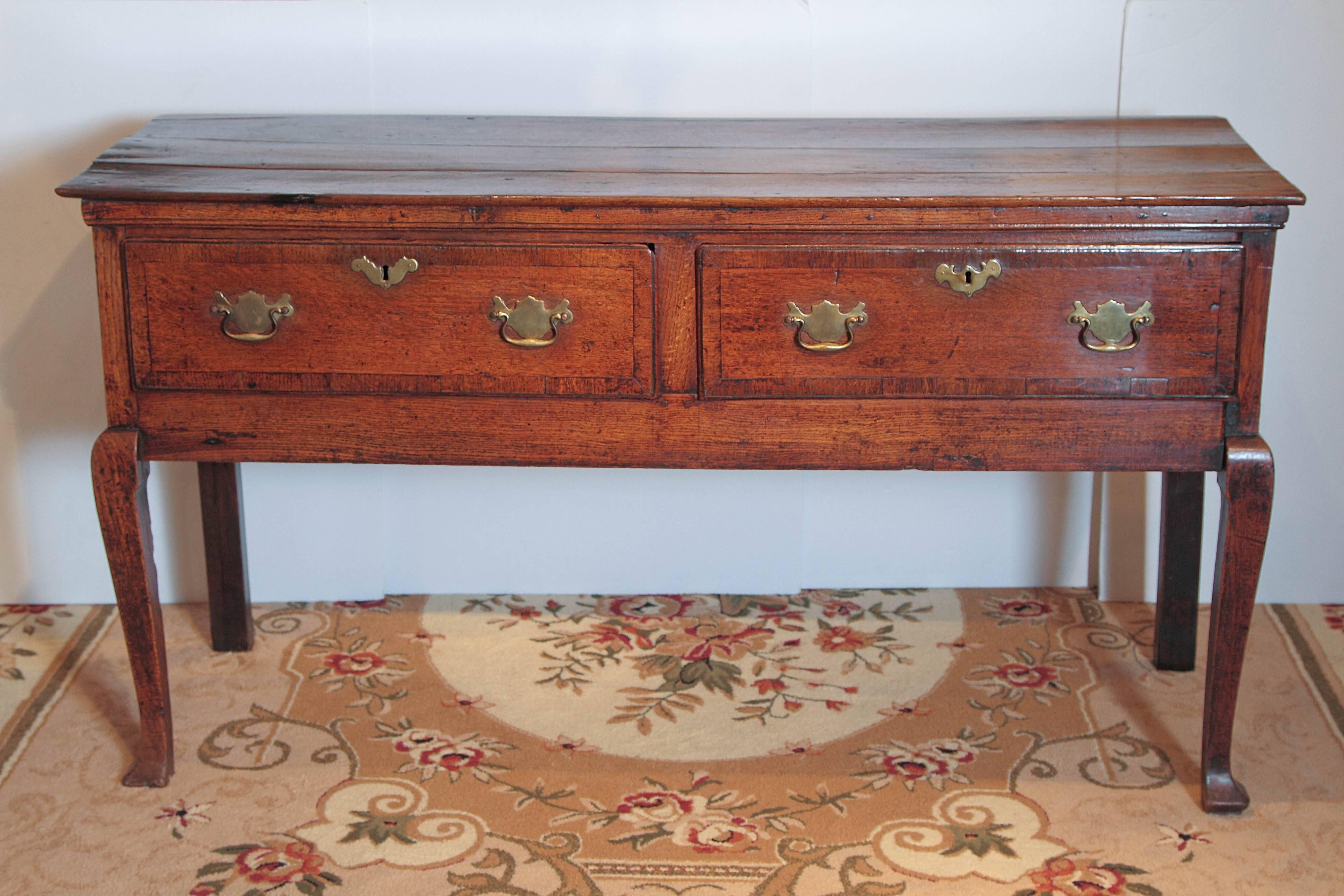 18th century Queen Anne period dresser base in oak.