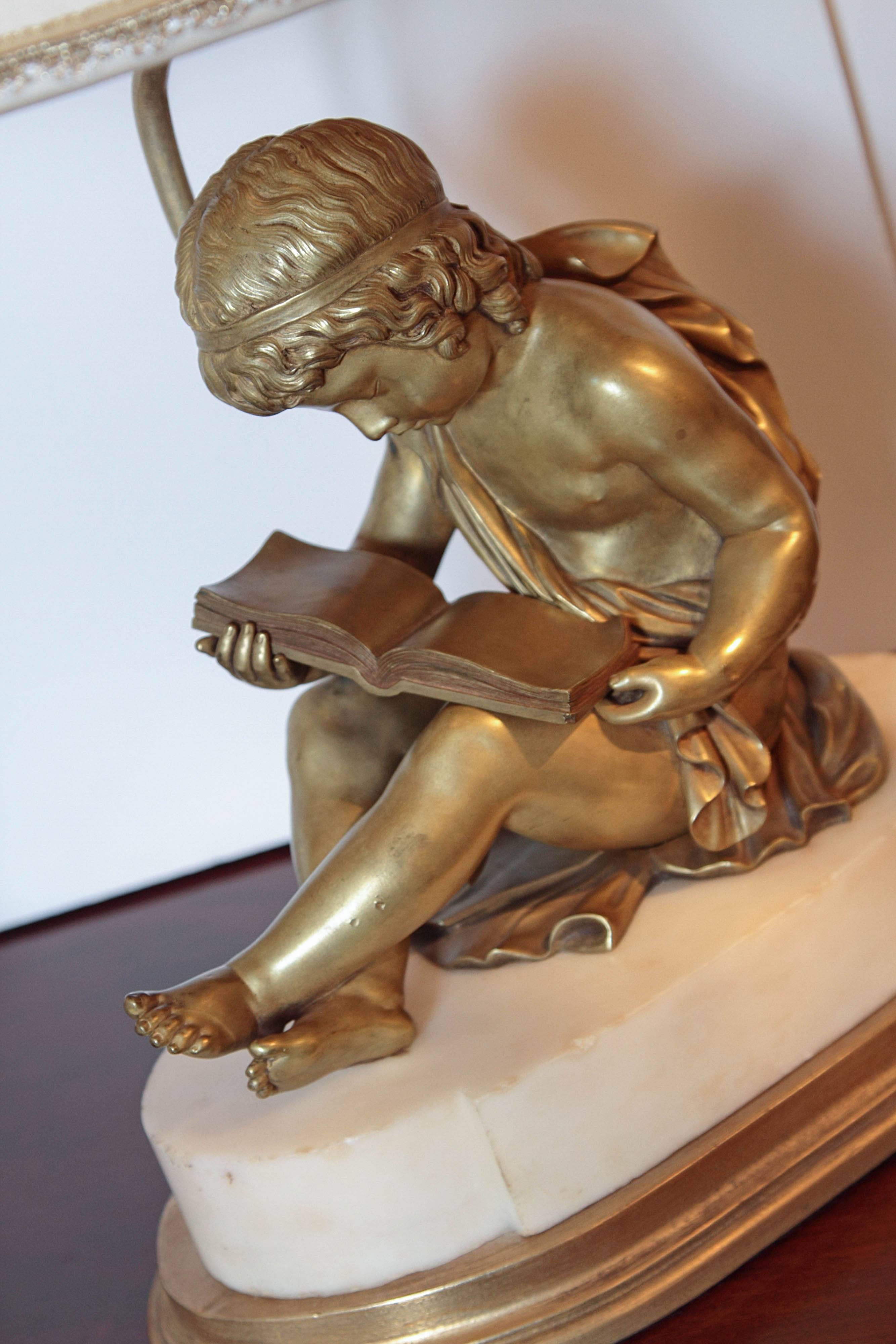Pair of French 19th Century Gilt Bronze Children Reading on White Marble Bases In Excellent Condition In Dallas, TX