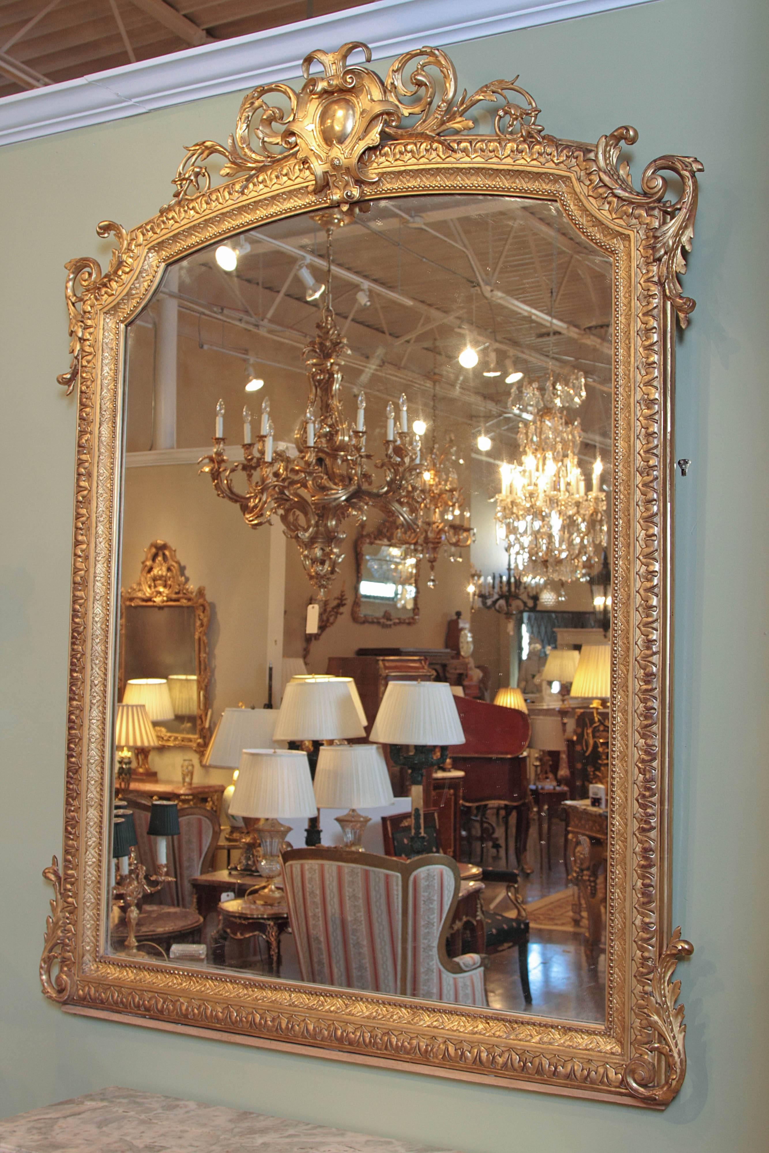 French large and finely carved 19th century Louis XV water gilt mirror.