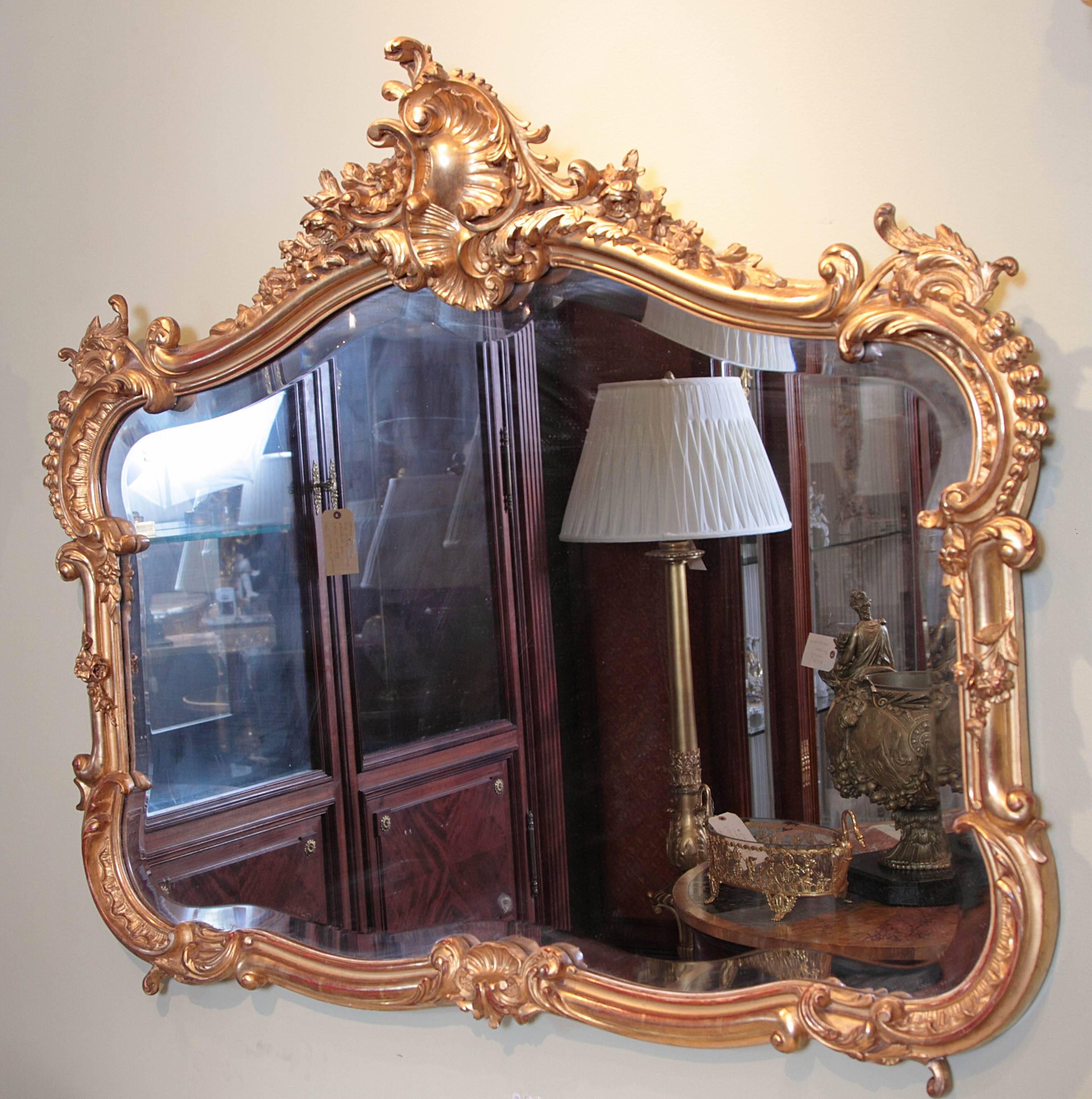 Finely carved French 19th century Louis XV gilt carved horizontal carved mirror.