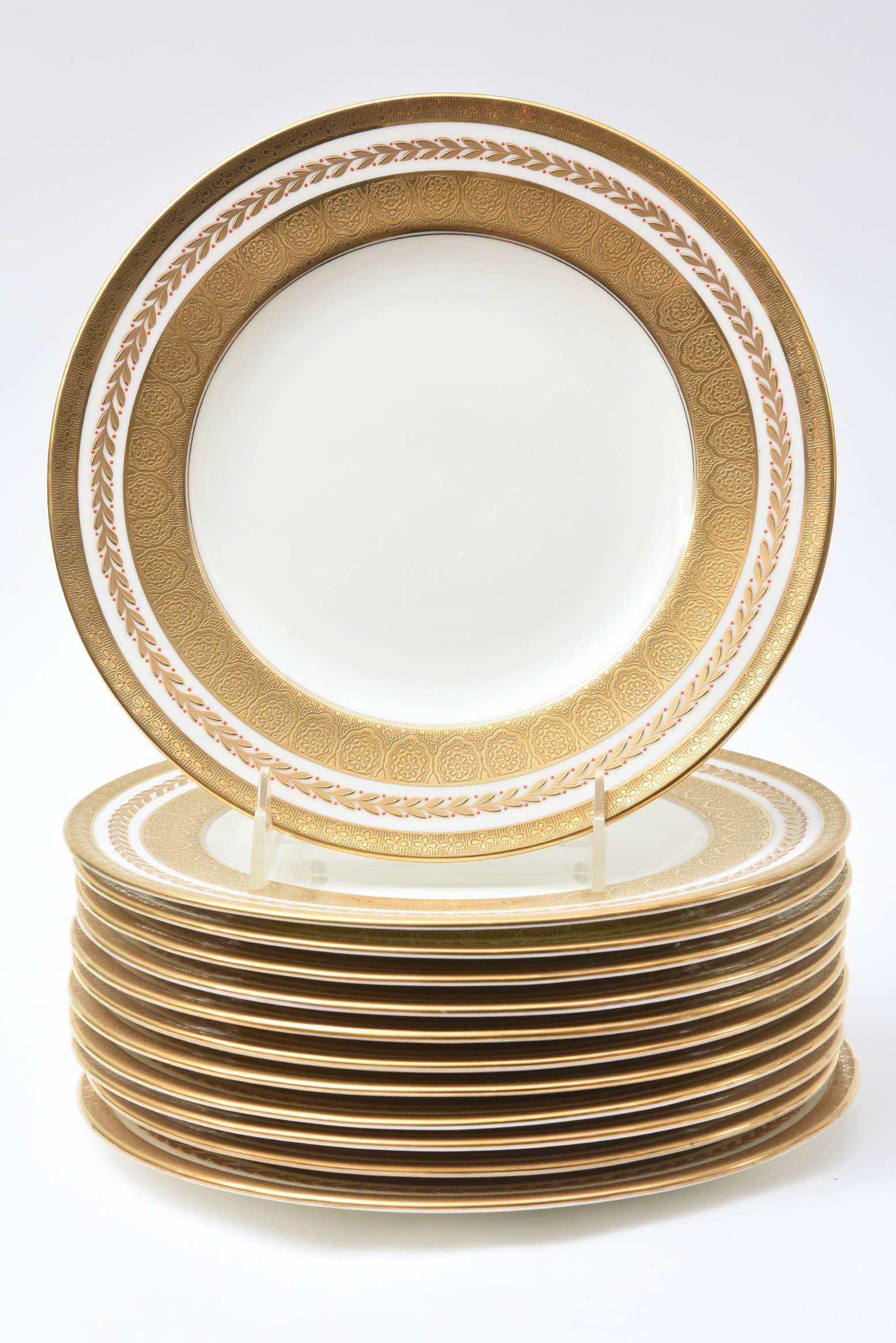 An elegant and tailored set of dinner plates by Cauldon, England custom ordered through the fine Gilded Age Retailer Tiffany & Co. Crisp white bone china and nice clear centres. This set came from the same estate as some of the other white and gold