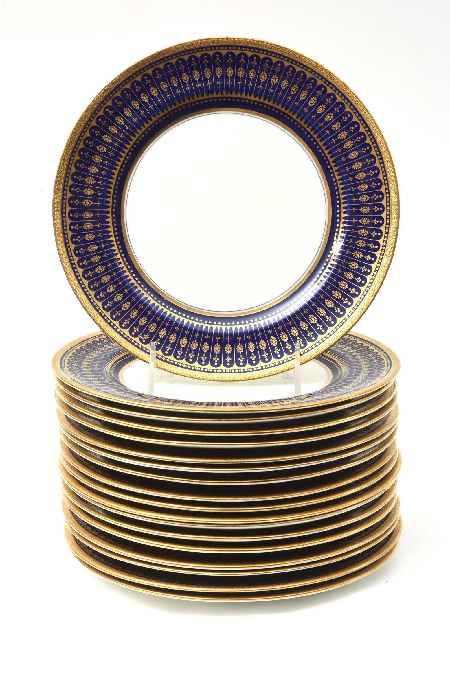 A hard to find large quantity set of 18 matching plates with an elegant stripe and gilt band design on a rich cobalt blue collar. A custom ordered set through one of New York's finest Gilded Age Retailer, Davis Collamore by Royal Doulton, England.