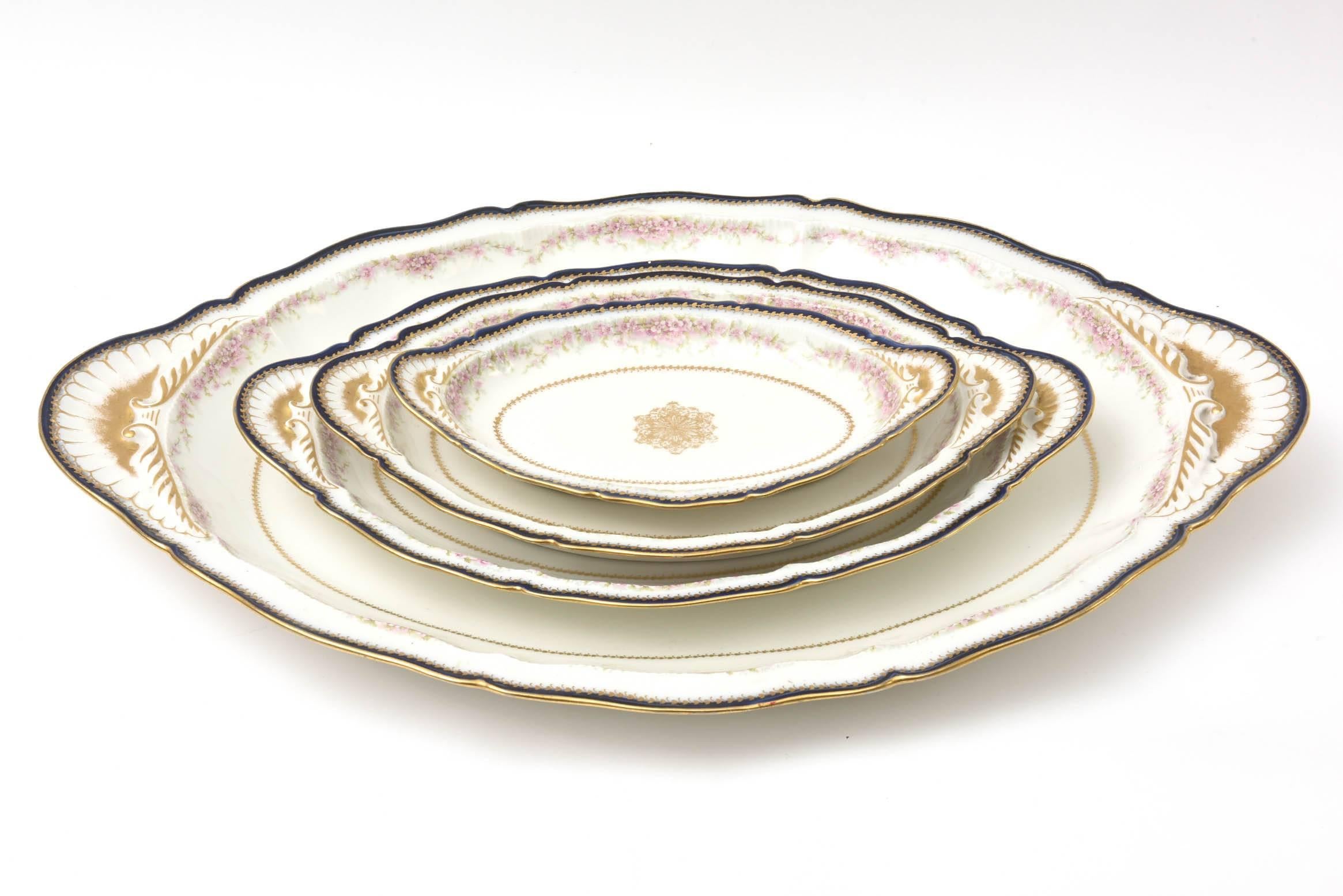 A great and hard to find set of four matching platters. Graduating in size from 10.0 inches to 19.0 inches in length. They have a delightful scallop to the edge as well as 
