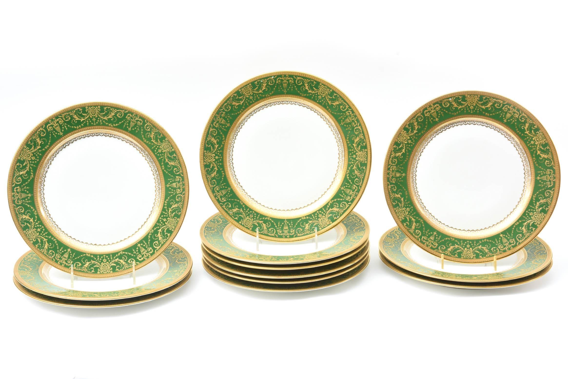 A gorgeous color of rich emerald green dinner plates by the storied Limoges Factory of William Guerin. Finely raised paste gilding is set upon a collar of dark green. A nice clean and crisp white center. These dinner plates are just a little bit