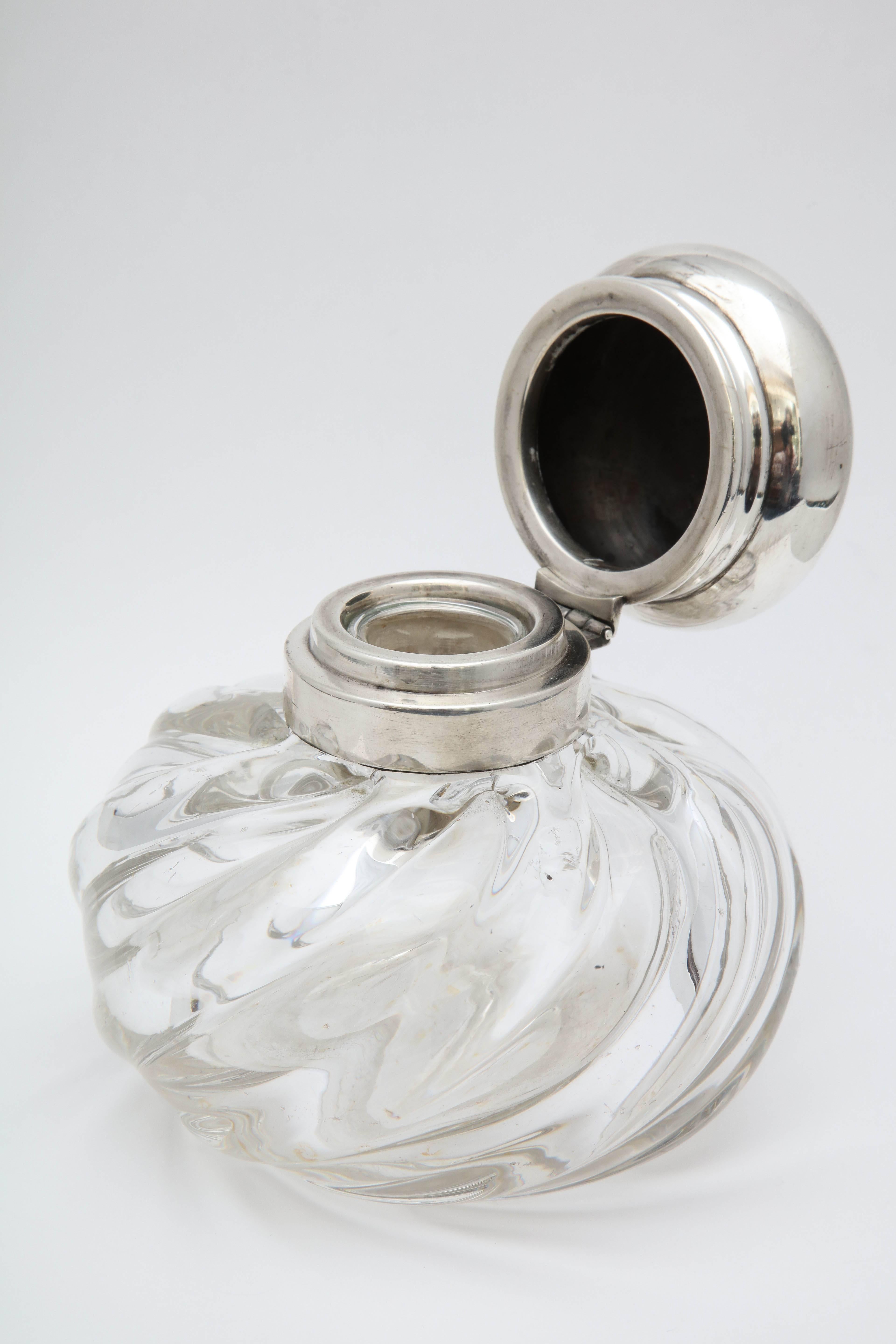 Large, Victorian, sterling silver mounted inkwell, Birmingham, England, 1897, Heath and Middleton (John Thomas Heath and John Hartshorne Middleton) makers. Crystal is swirled in design. Measures 5 inches high x 5 inches in diameter at widest point.